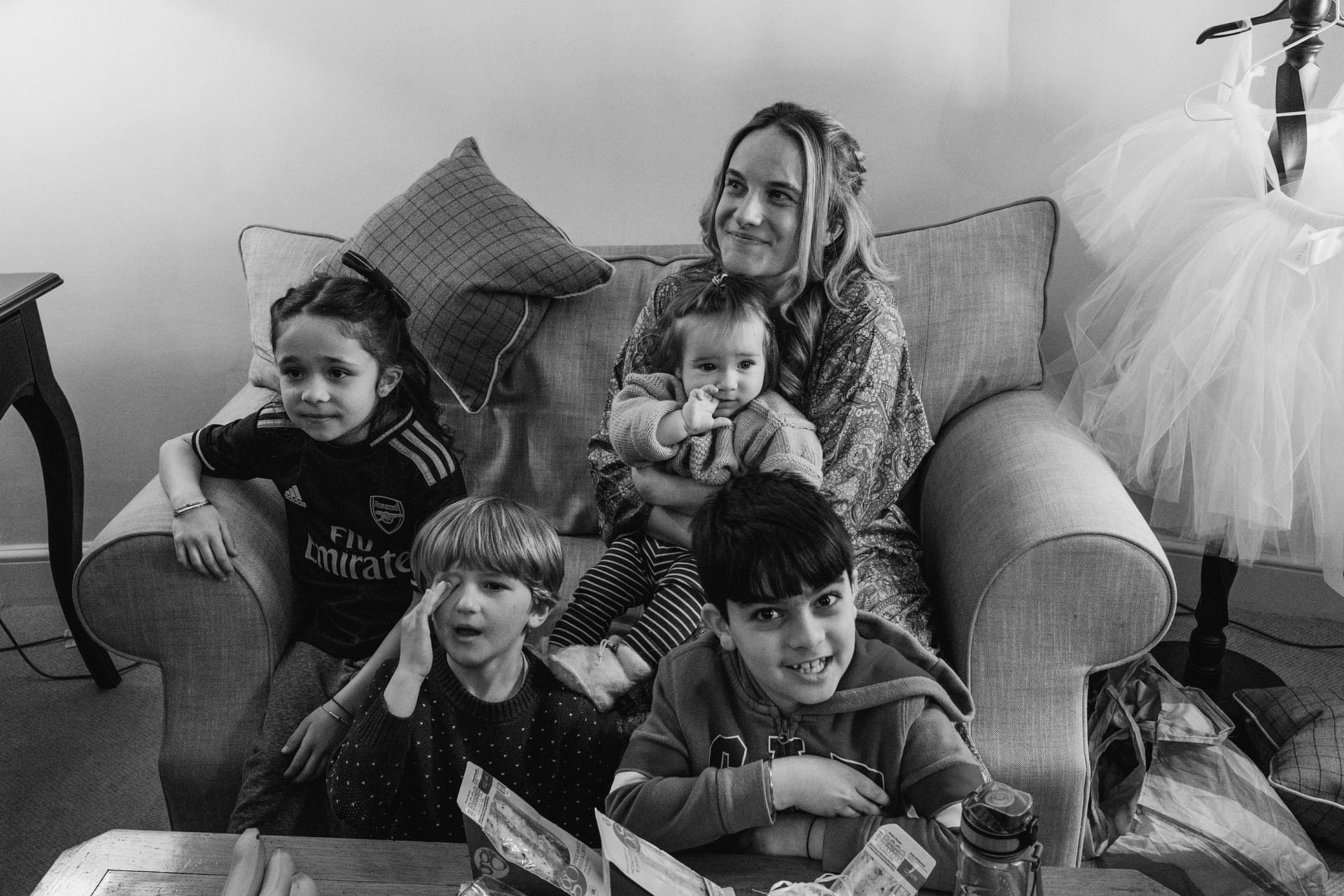 bride with family sat on sofa in suffolk