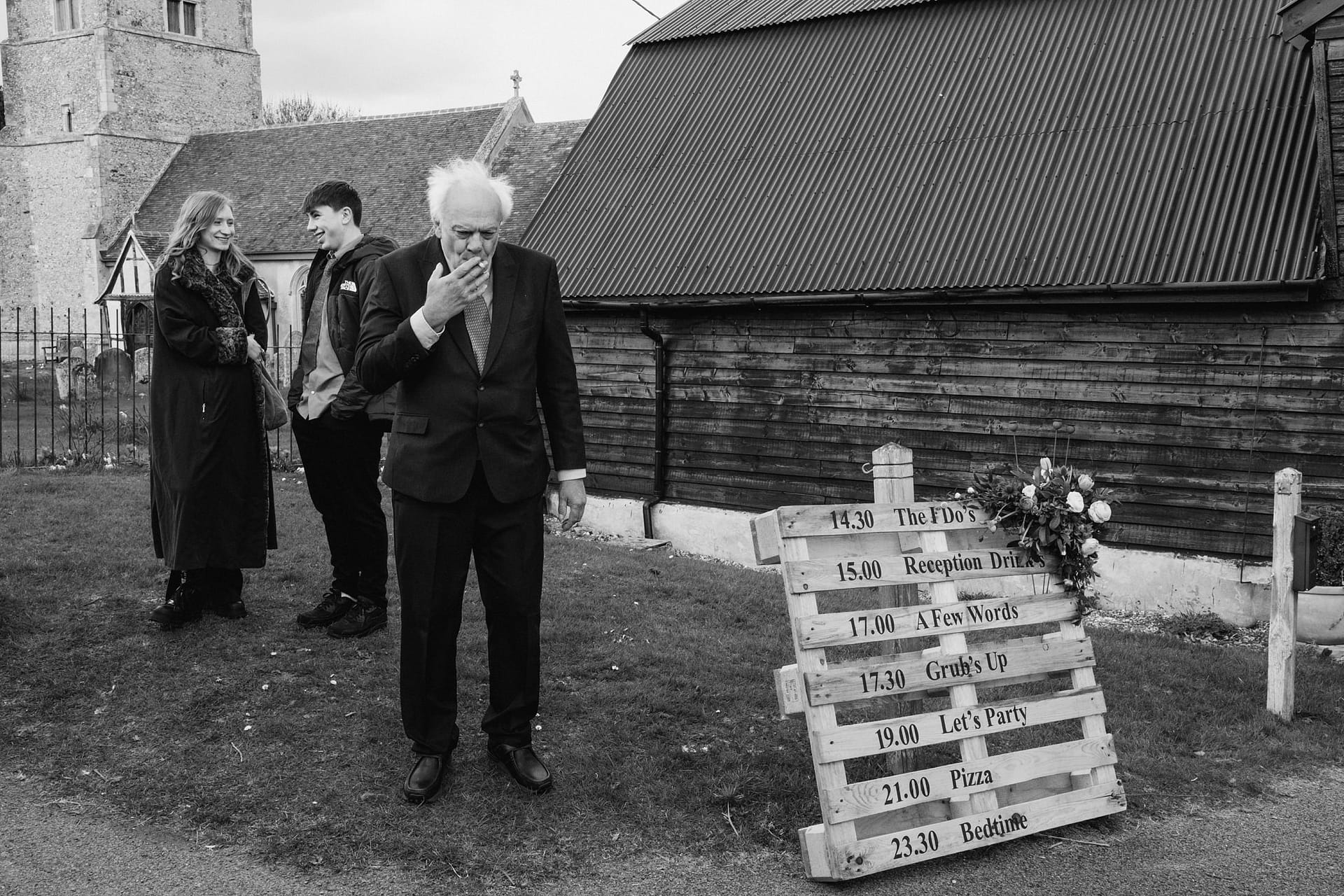 elderly gentleman smoking outside Alpheton Barns suffolk