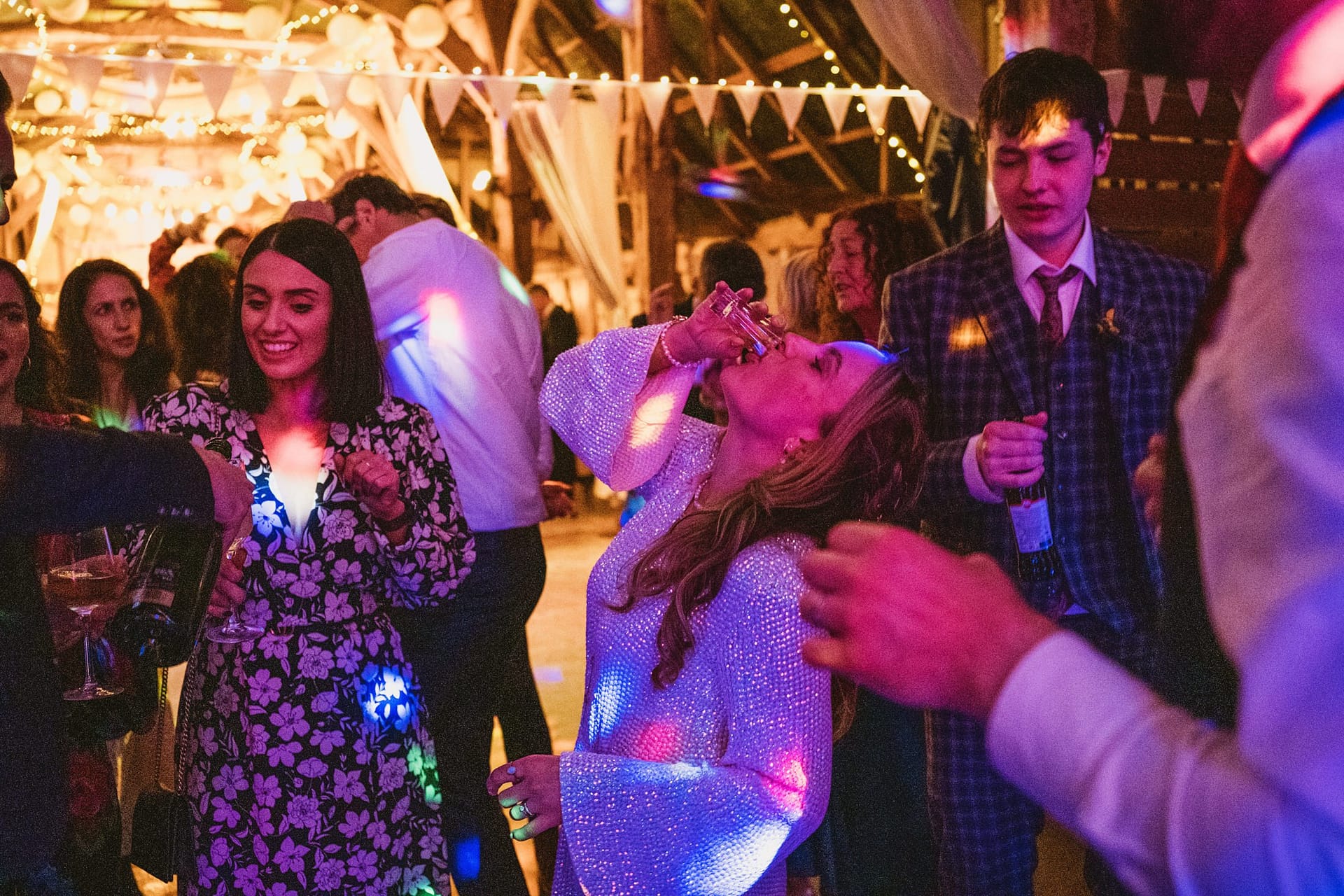bride drinking on dance floor at Alpheton Barns suffolk