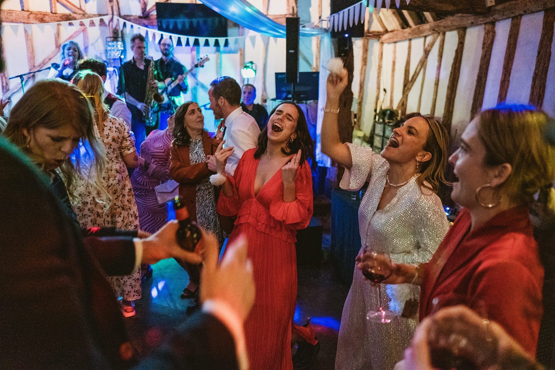 bride and wedding guests dancing at Alpheton Barns reception