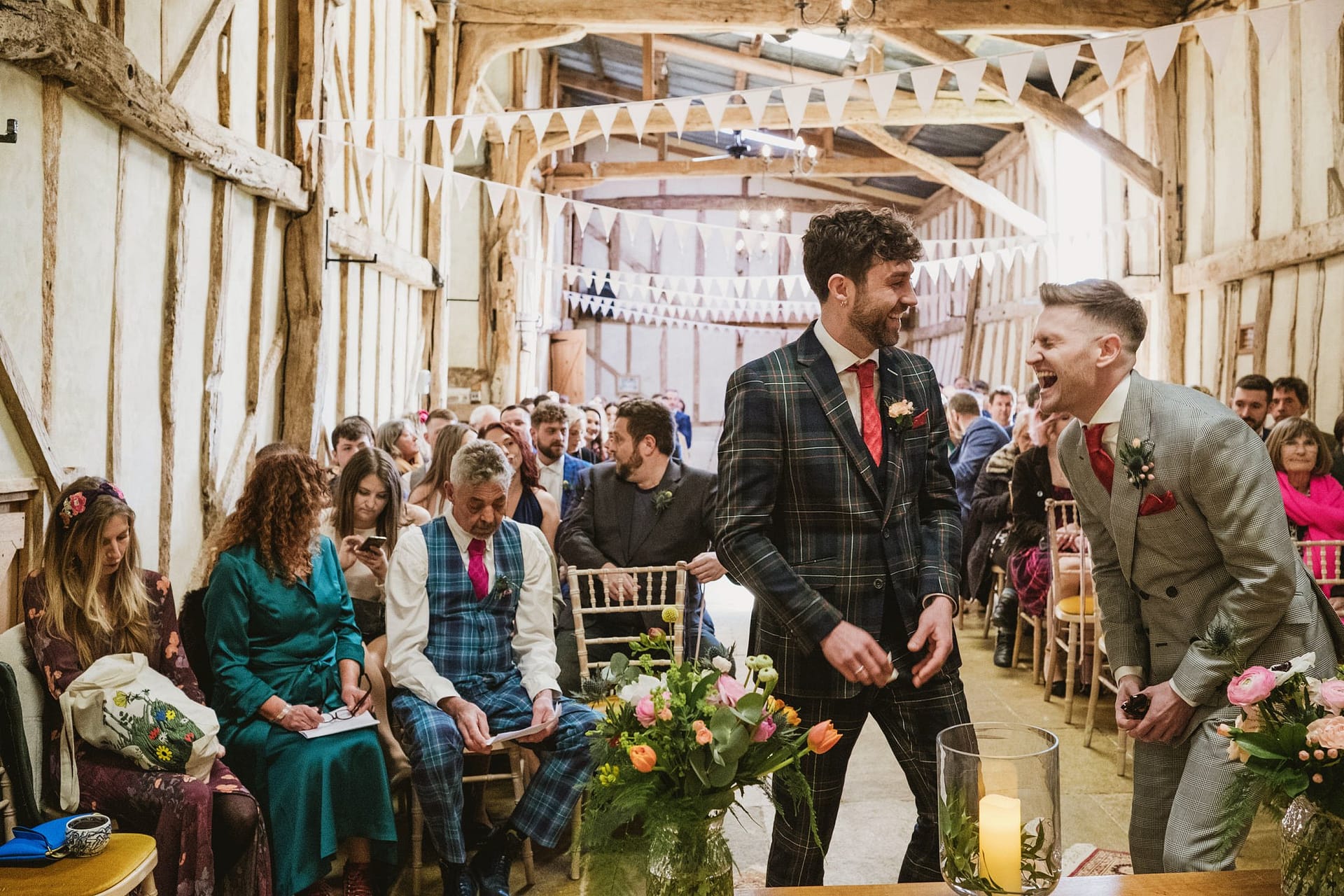 Alpheton Barns wedding ceremony, groom and best man laugh before ceremony