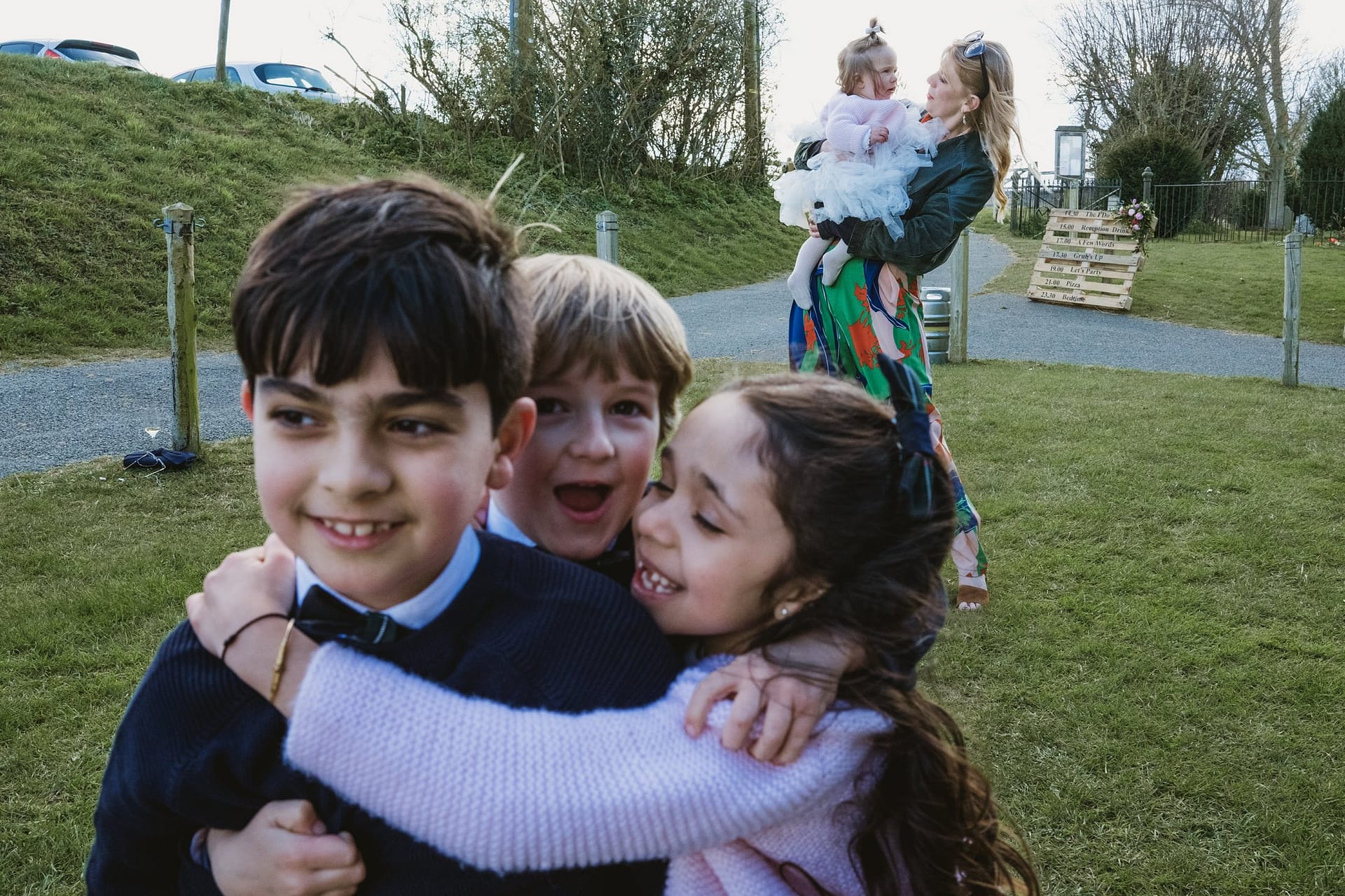 wedding guests at Alpheton Barns in suffolk, children hugging