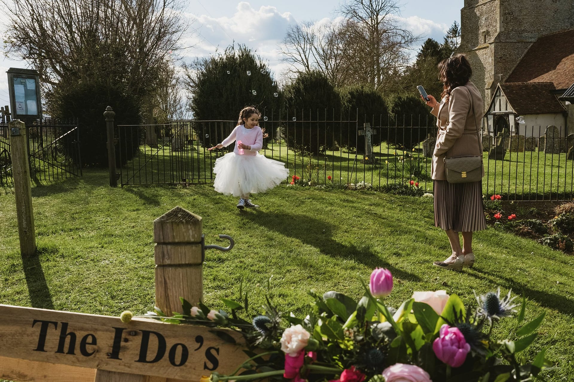 flower girl spinning on grass at Alpheton Barns