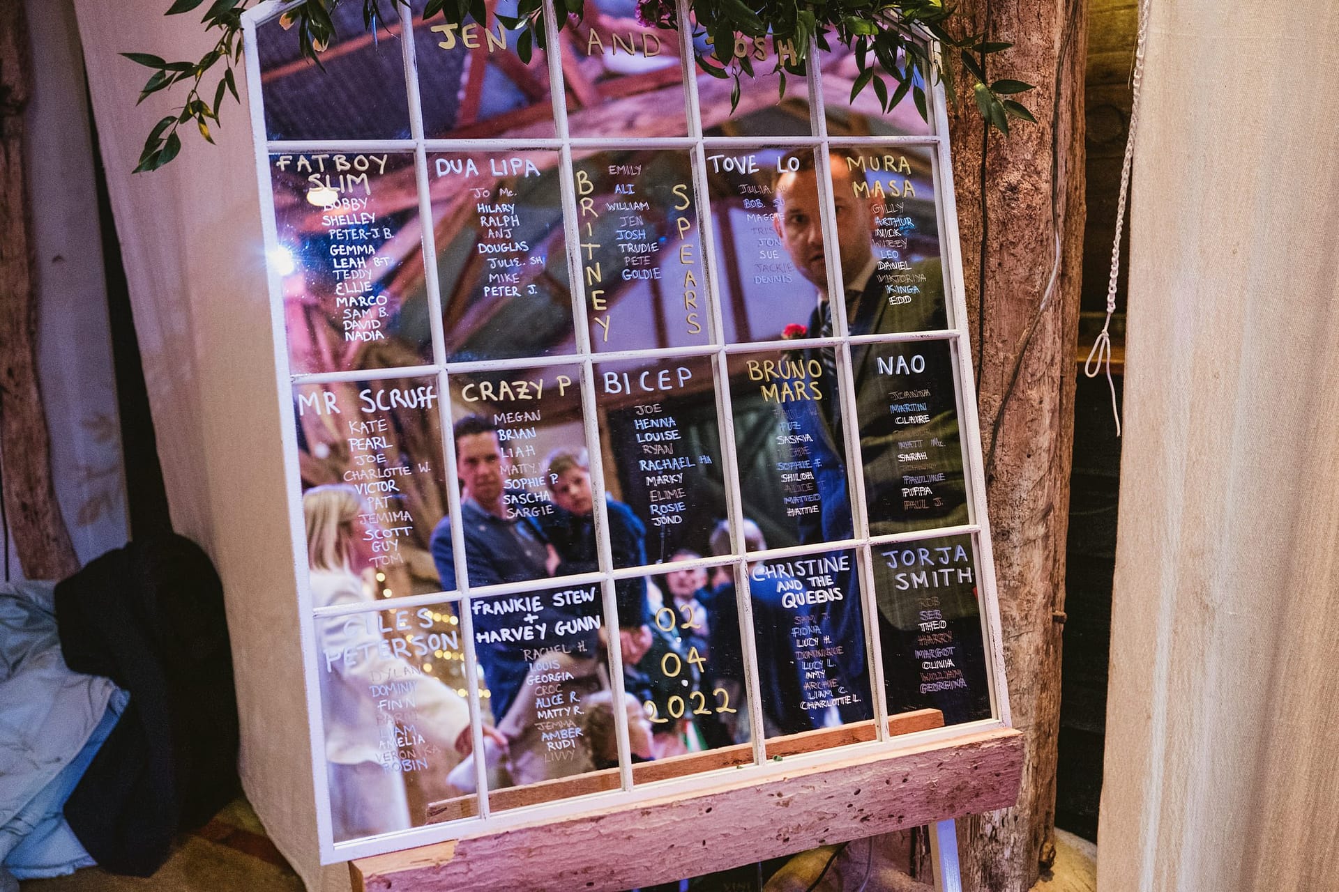 table plan at Alpheton Barns wedding guests looking at plan
