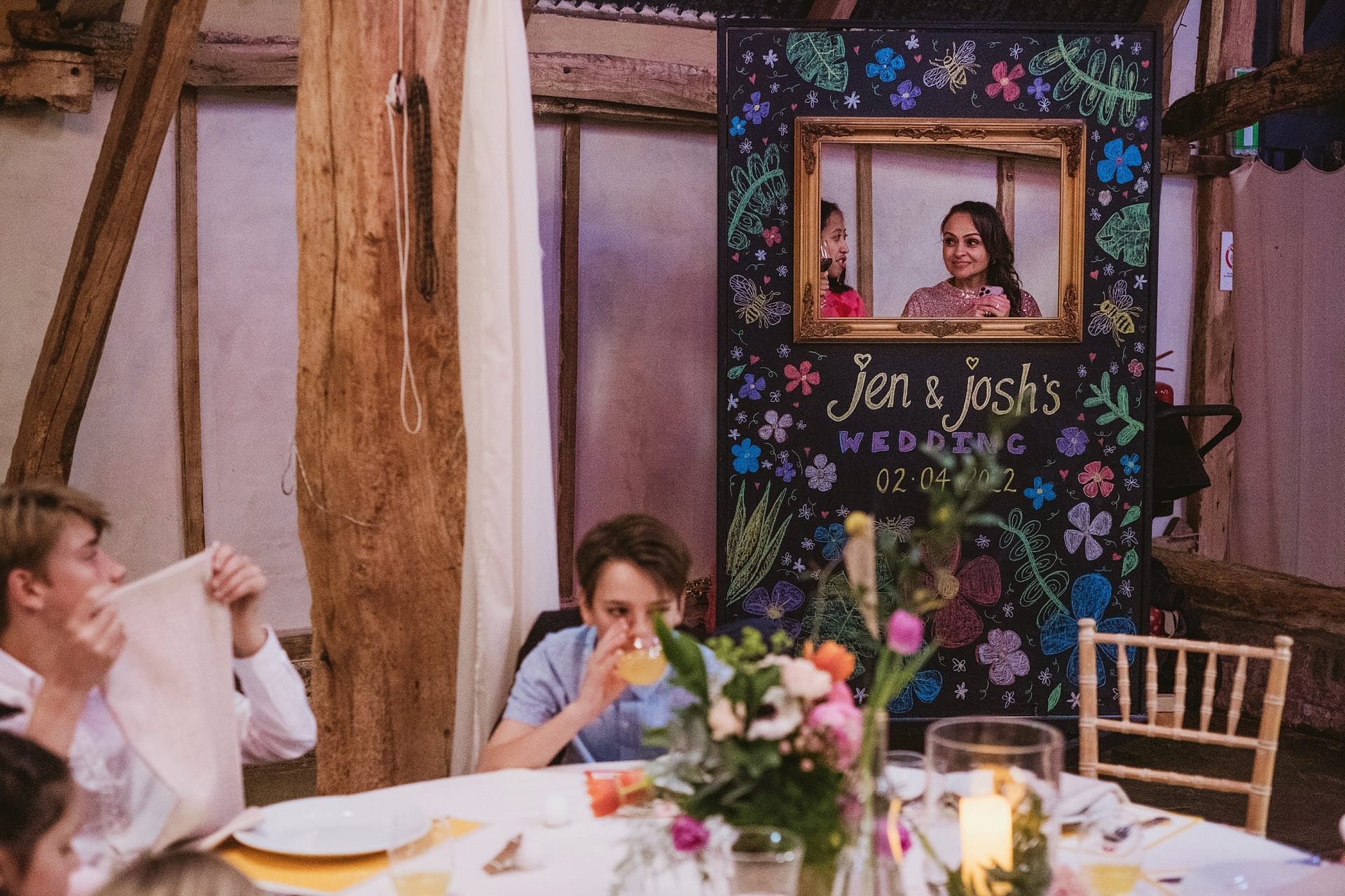 wedding guests at table at Alpheton Barns in suffolk