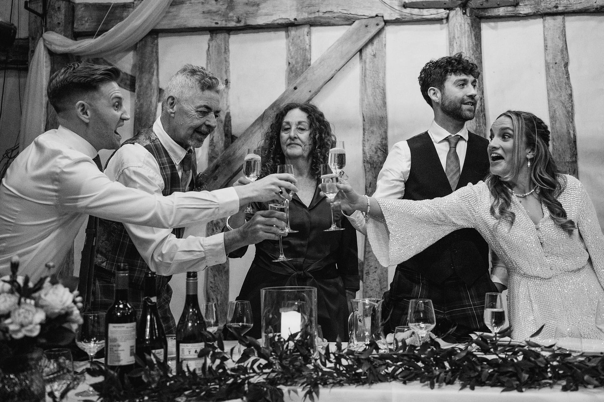 wedding guests cheering at Alpheton Barns suffolk