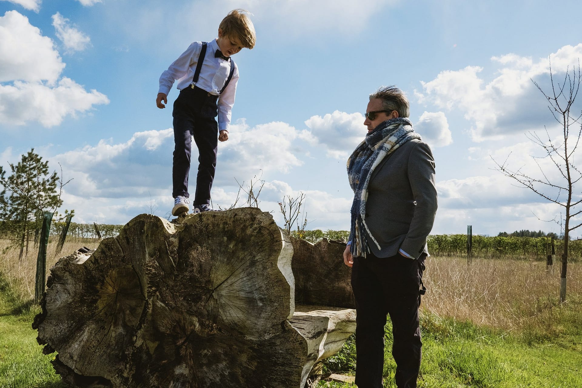 little boy climbing on a rock at Alpheton Barns