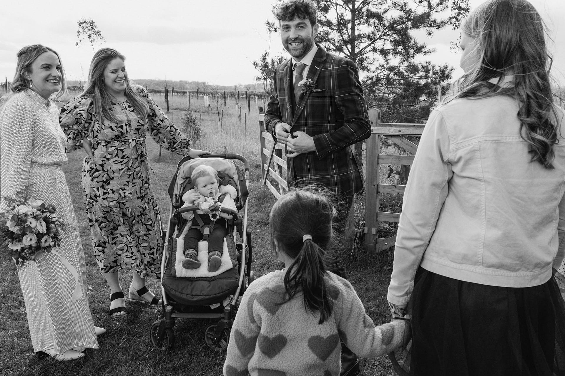 groom and bride greeting guests at Alpheton Barns