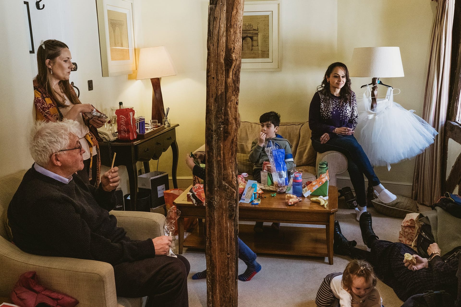 family sat waiting for bride at Alpheton Barns in suffolk