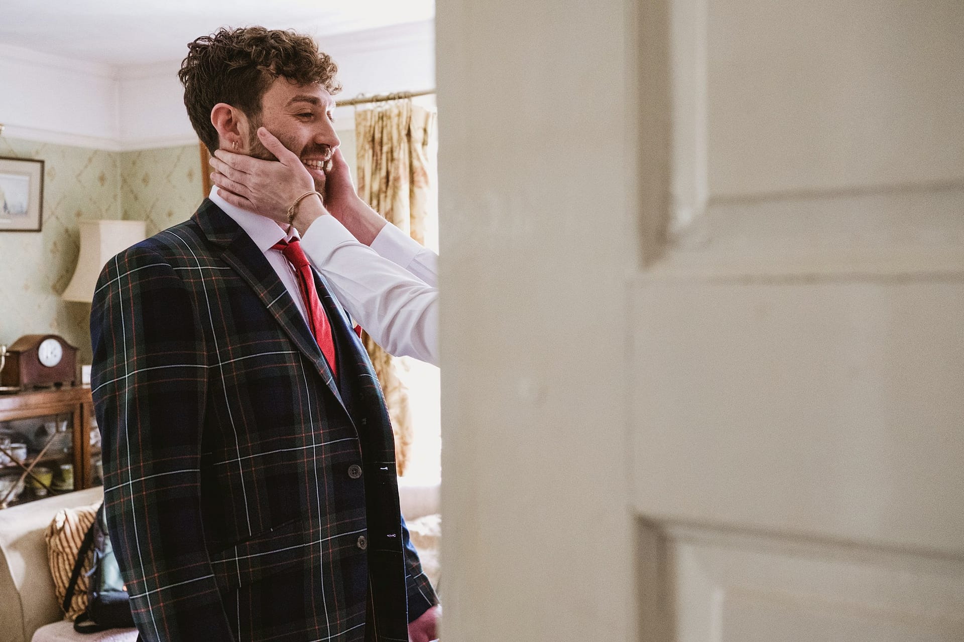 groom having his face squashed in Suffolk