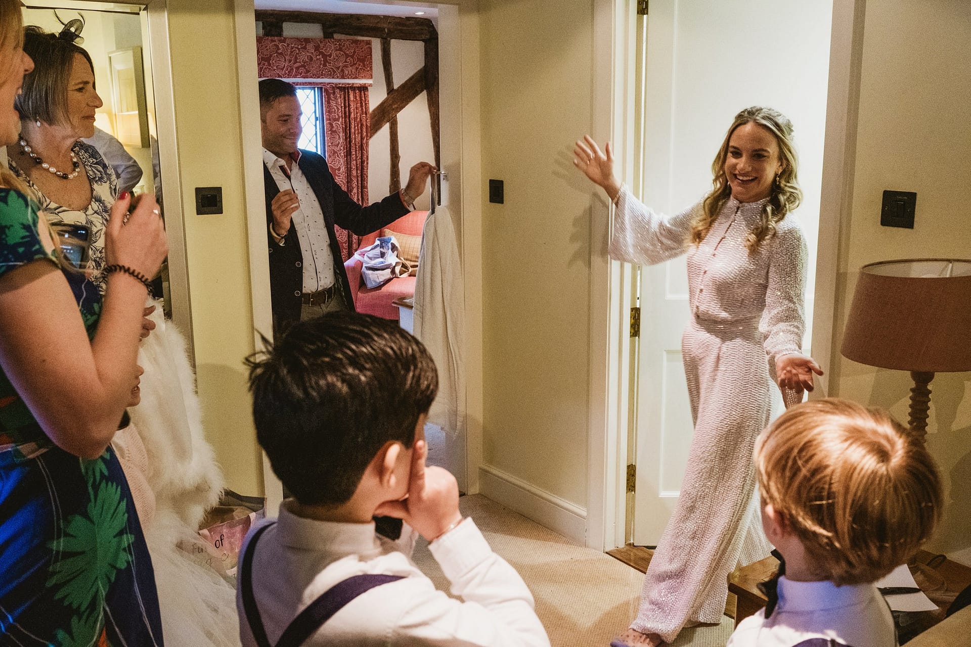 bride revealing her outfit at Alpheton Barns