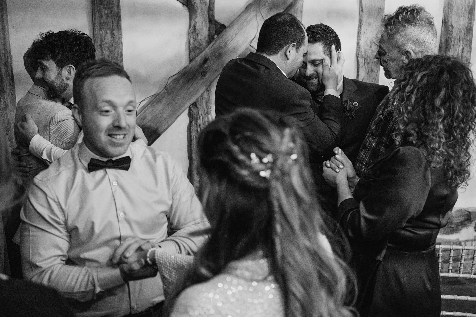 Alpheton Barns wedding reception, guests hugging