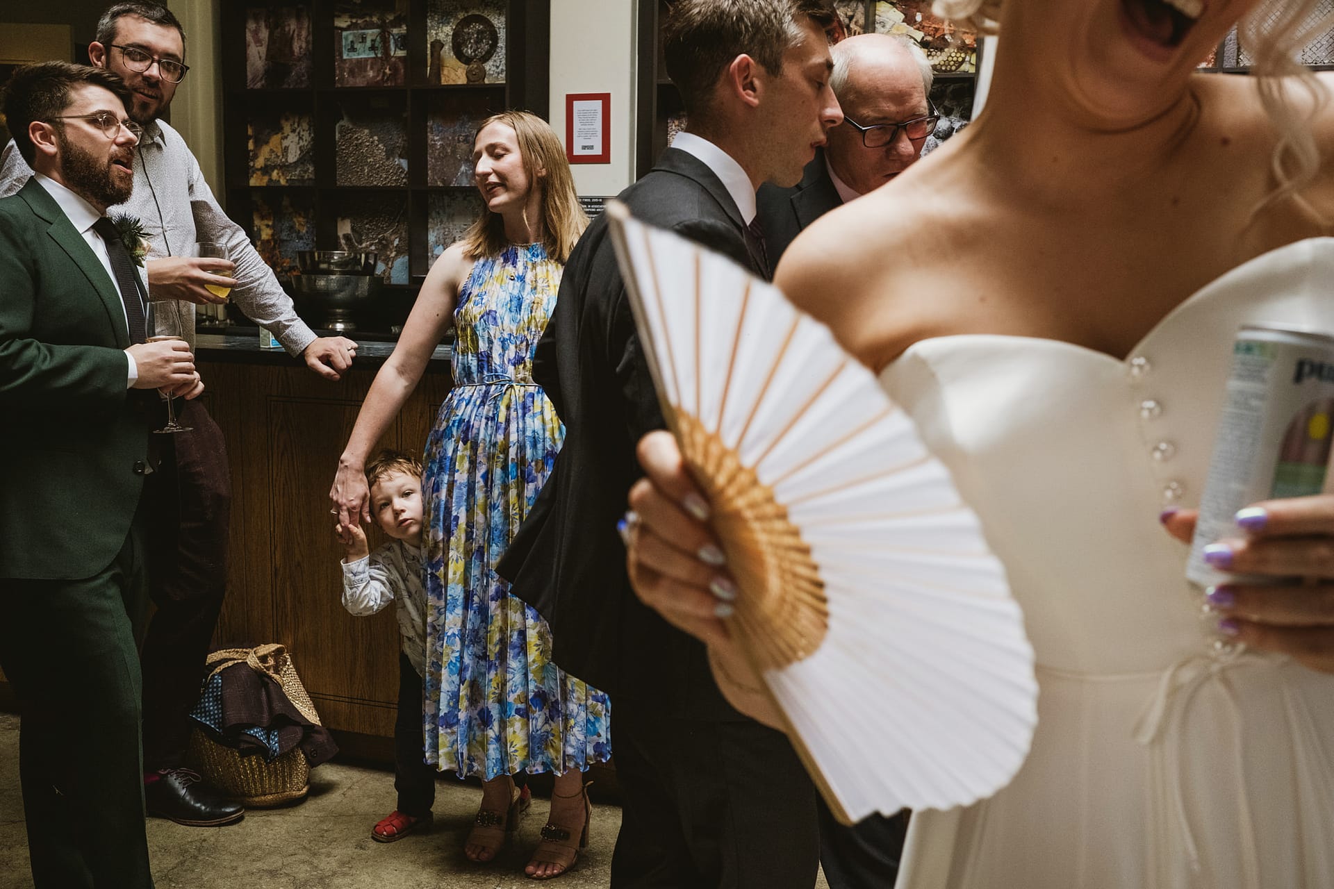 Group socialising at a wedding reception.
