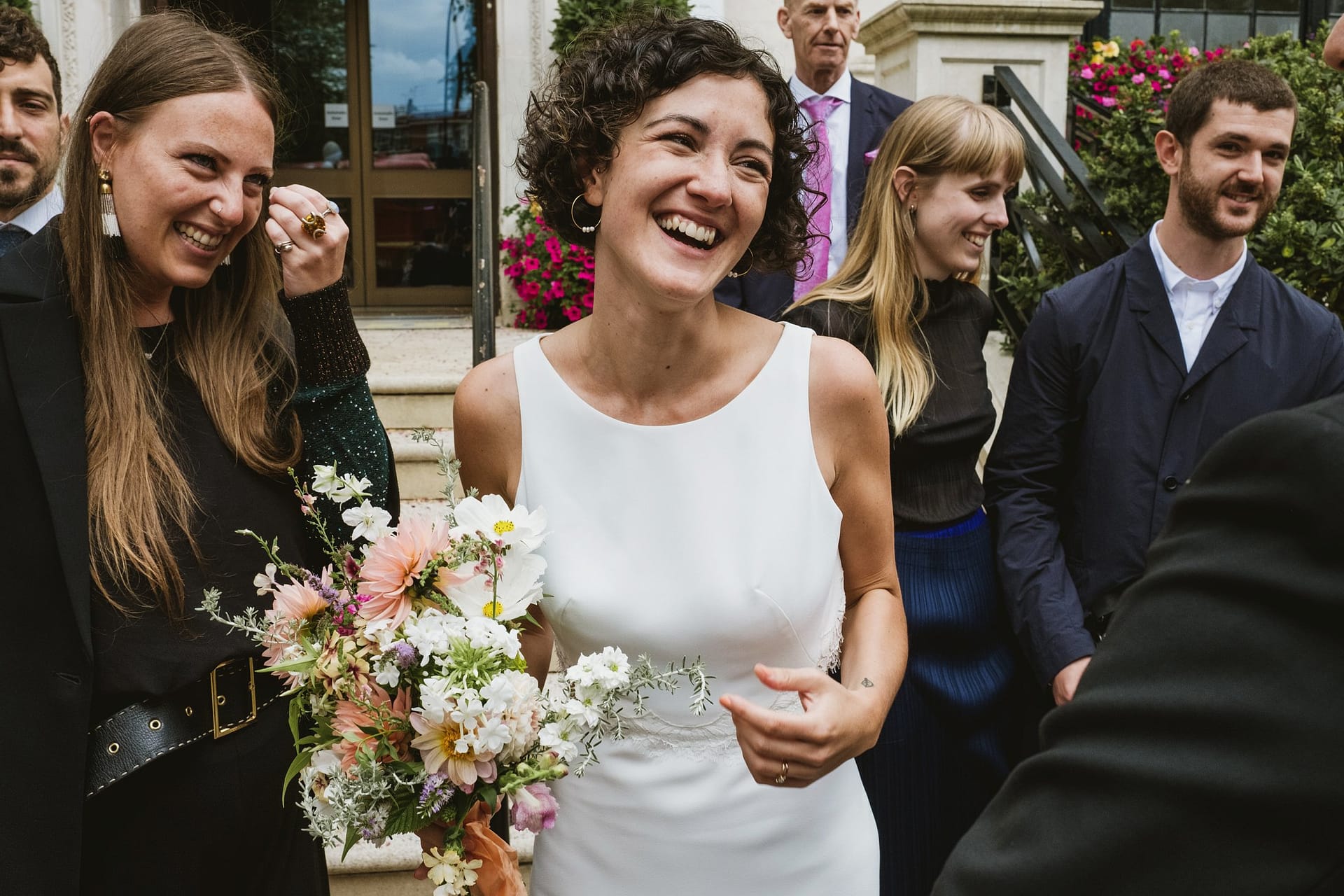 bride with wedding guests at islington town hall in london