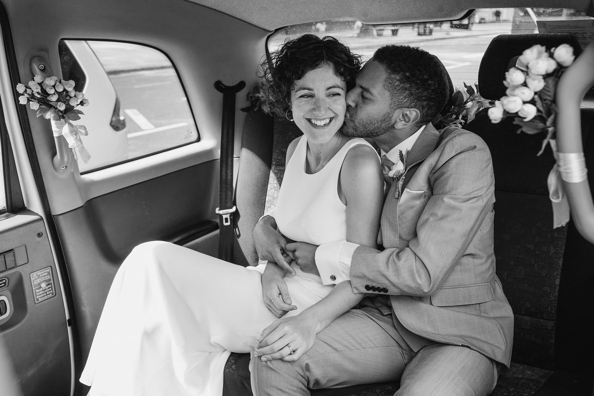 bride, groom in the wedding car at islington town hall