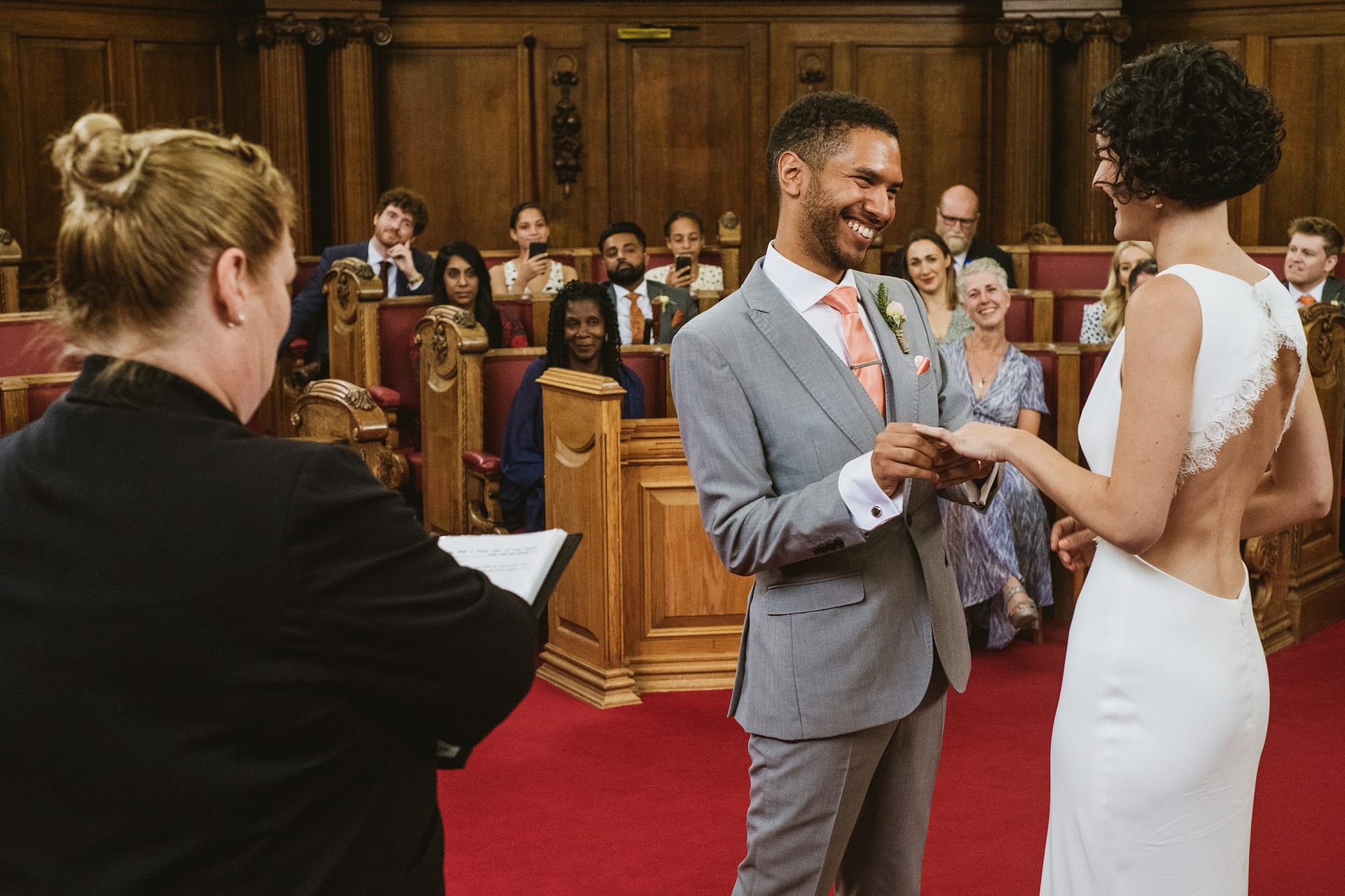 bride and groom exchanging vows at Islington Town Hall