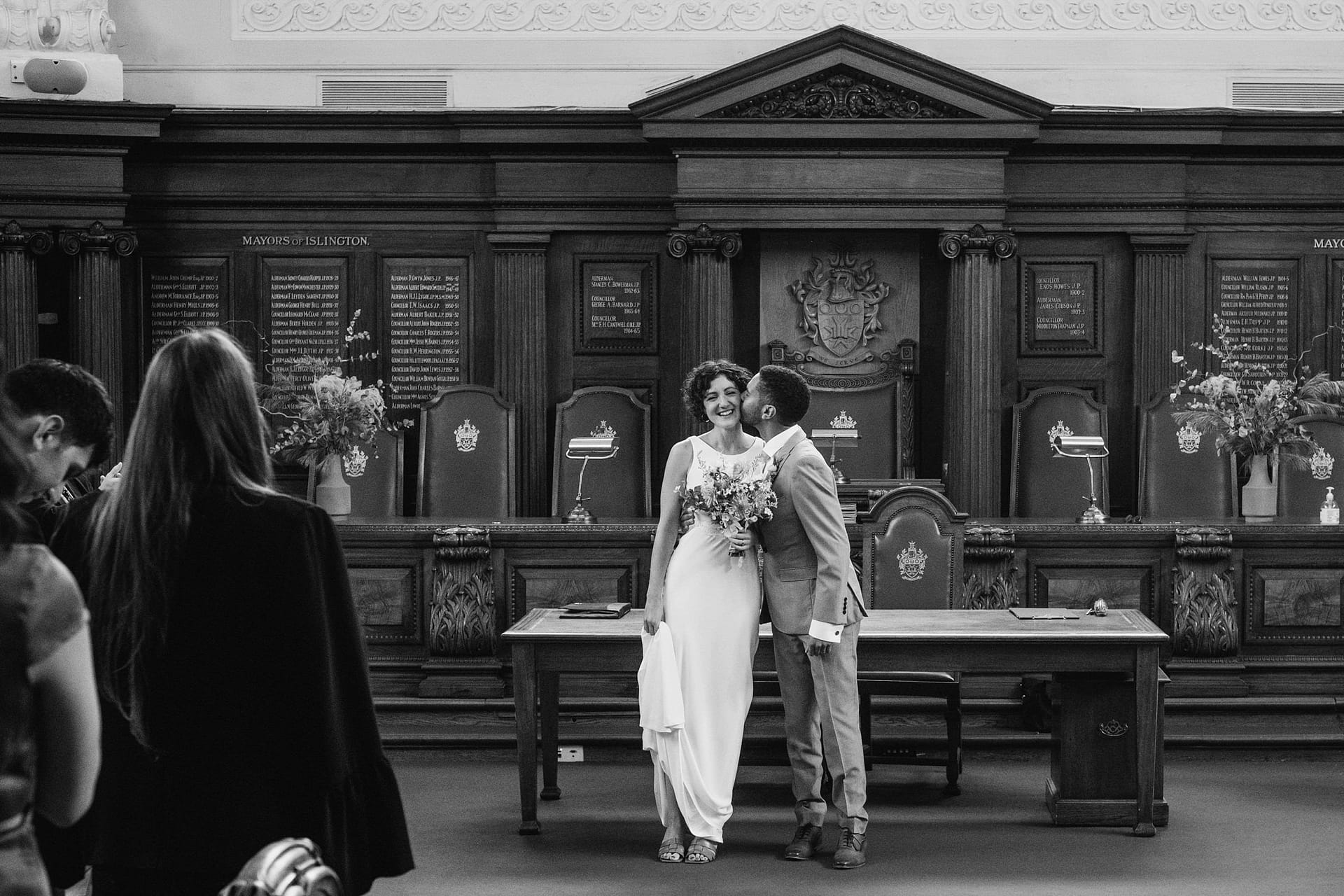 bride and groom kissing at Islington Town Hall
