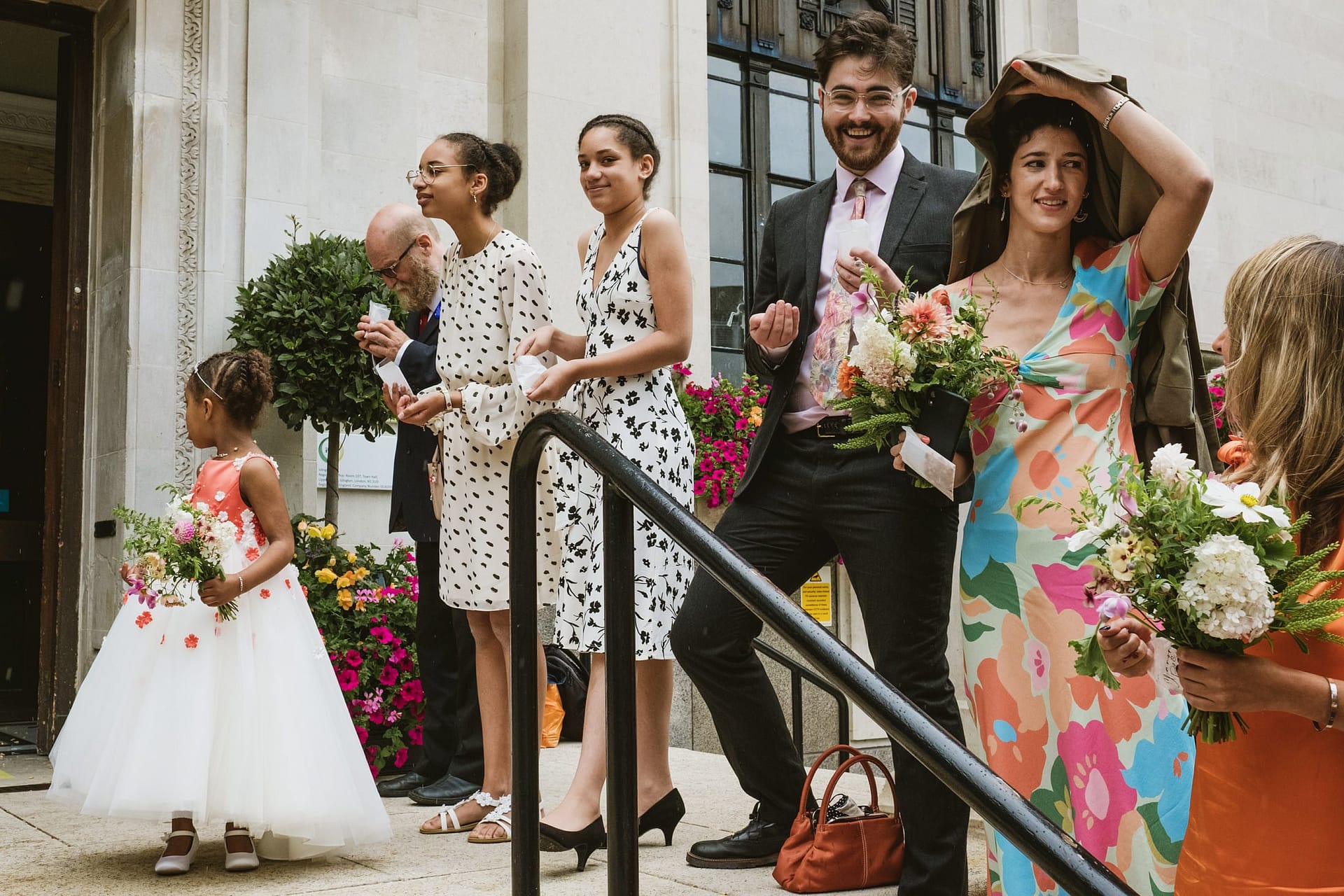 guests waiting for bride and groom with confetti at Islington Town Hall
