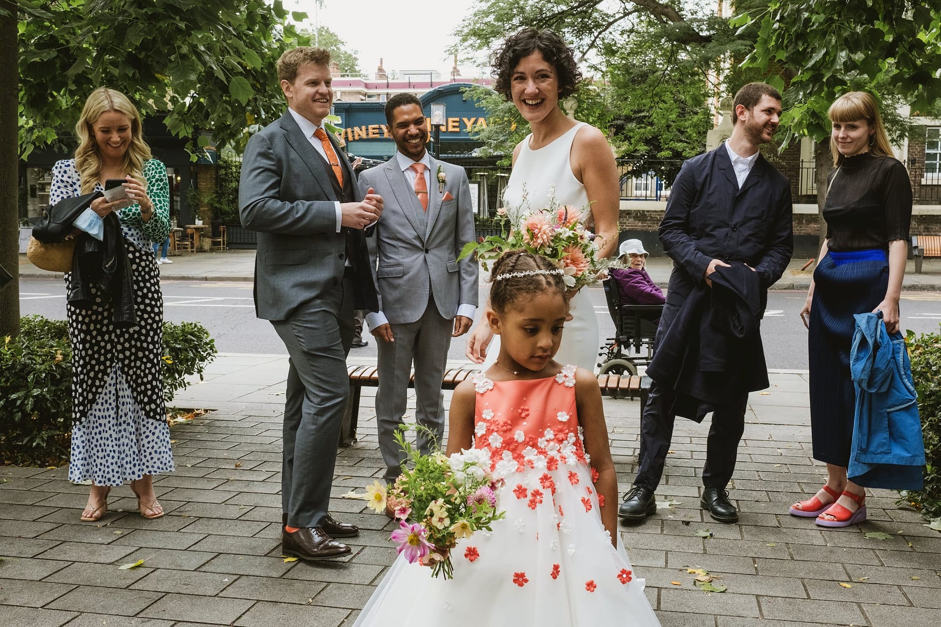 bride watching flower girl get ready for the Islington Town Hall wedding ceremony