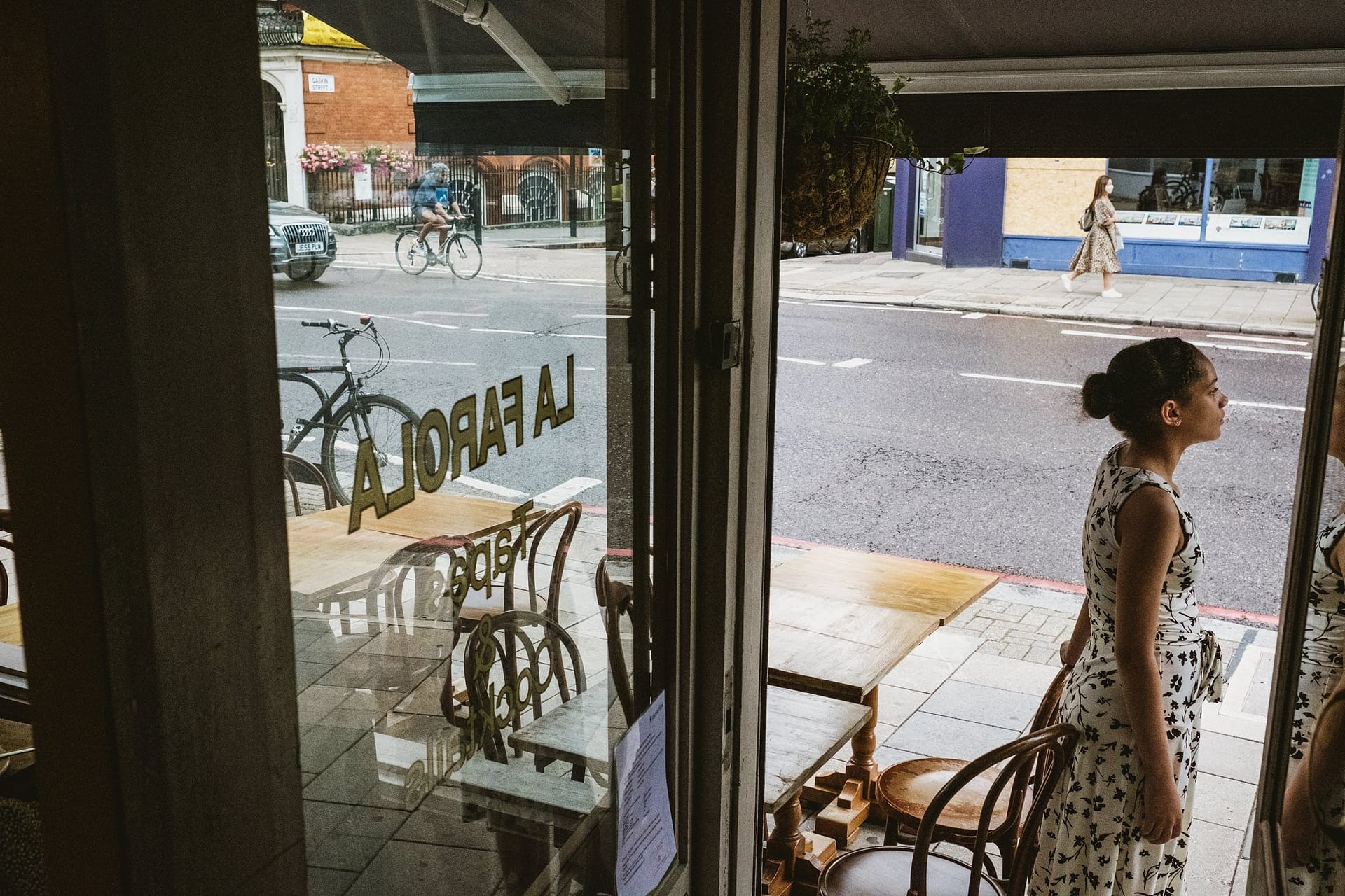 flower girl looking out at La Farola restaurant