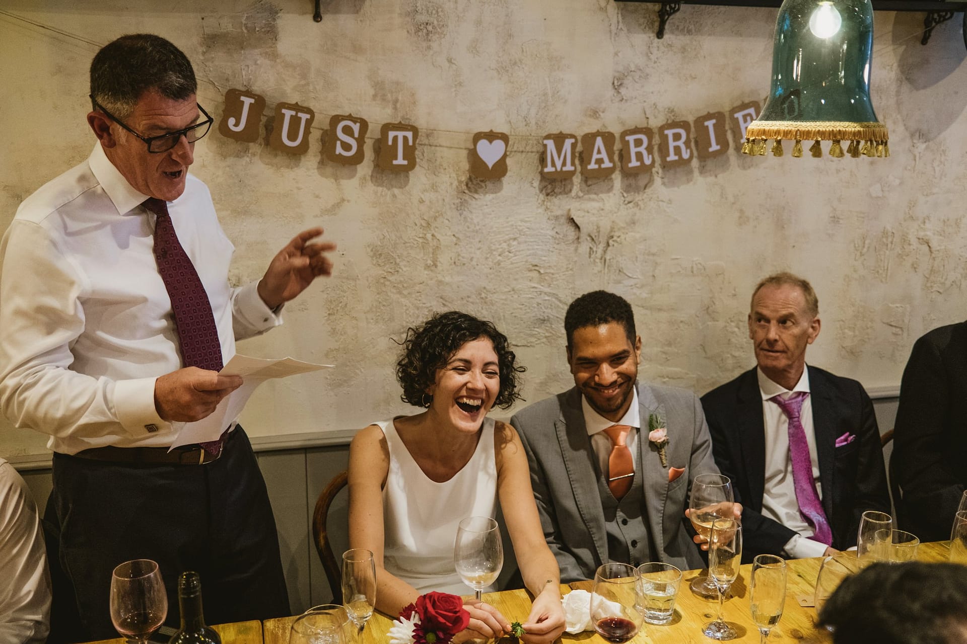 bride, groom and wedding guests listening to the father of the bride speech at La Farola restaurant in london