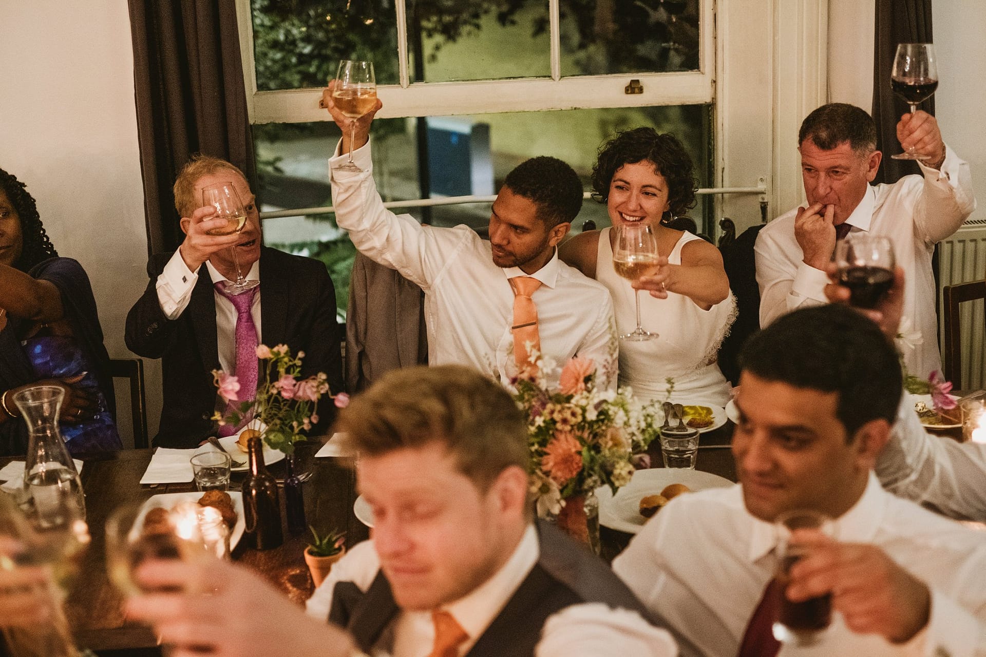 bride, groom and wedding guests all celebrating during the speeches at Prince Albert Camden