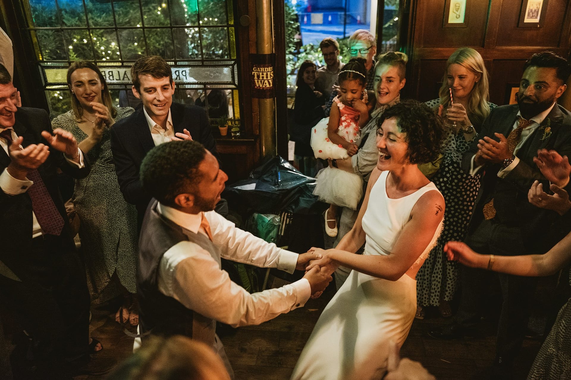 bride and groom spinning around dancing at Prince Albert pub in london