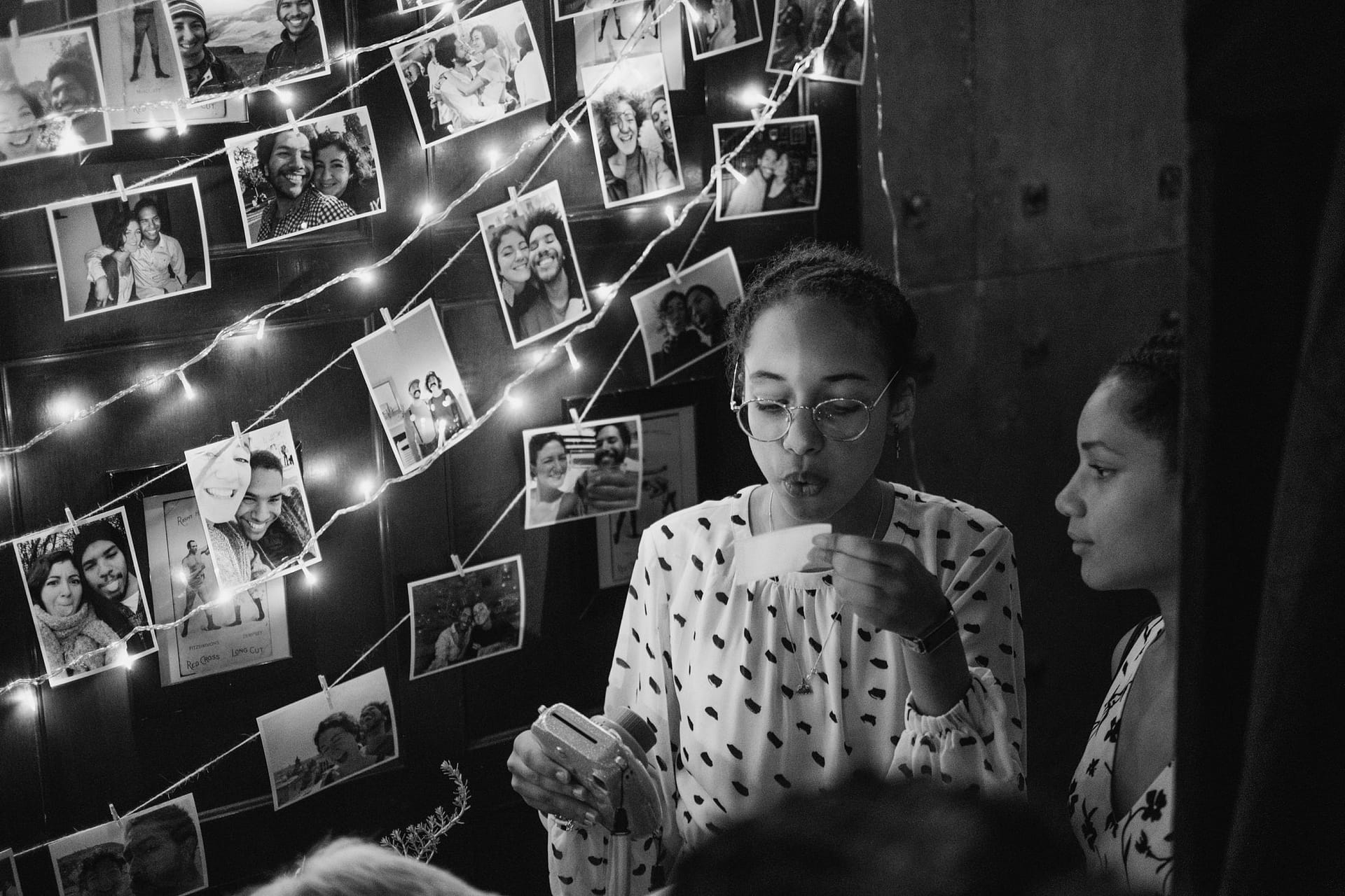 flower girl holding instax photo at Prince Albert pub in Camden