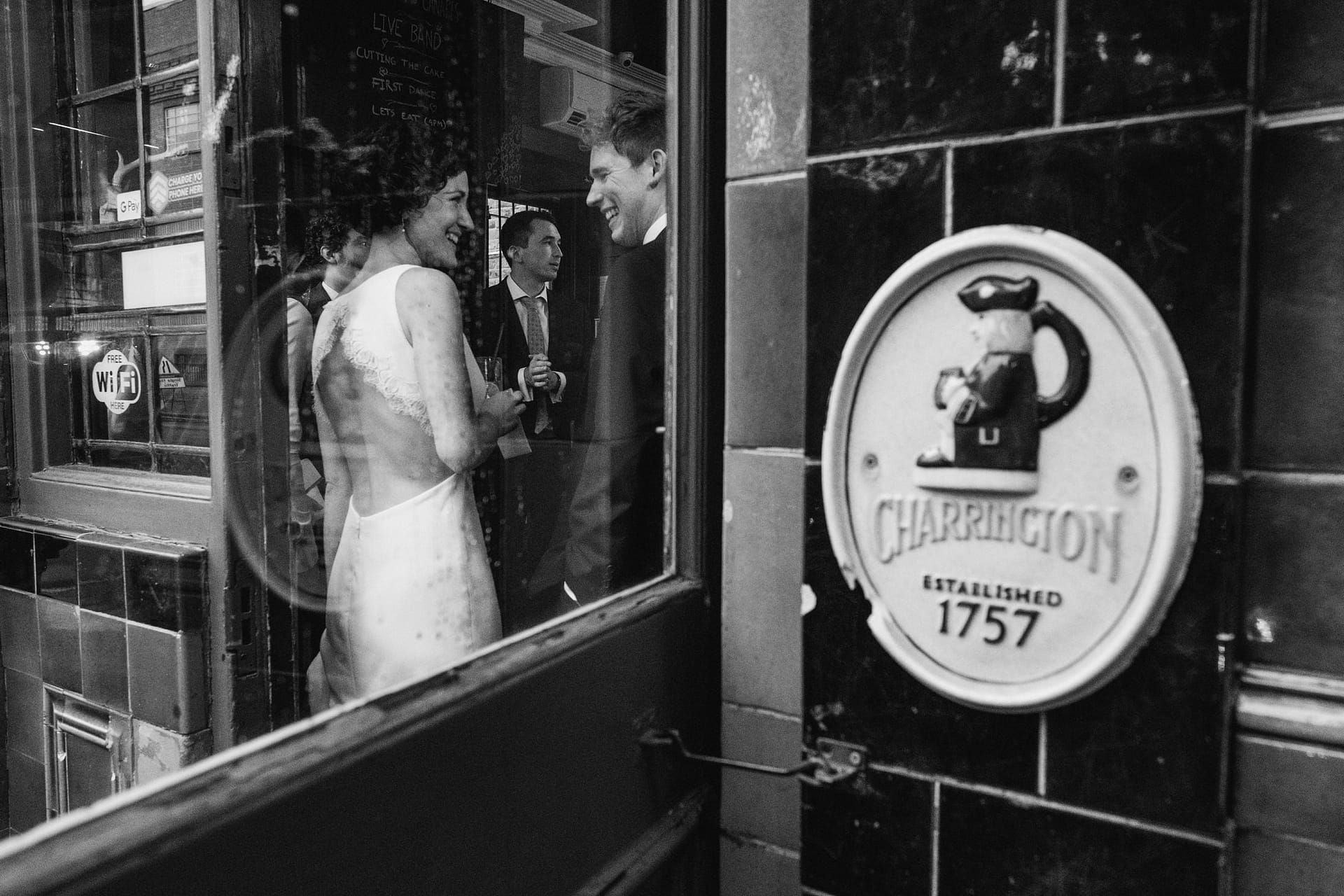 bride framed through window at Prince Albert pub in Camden