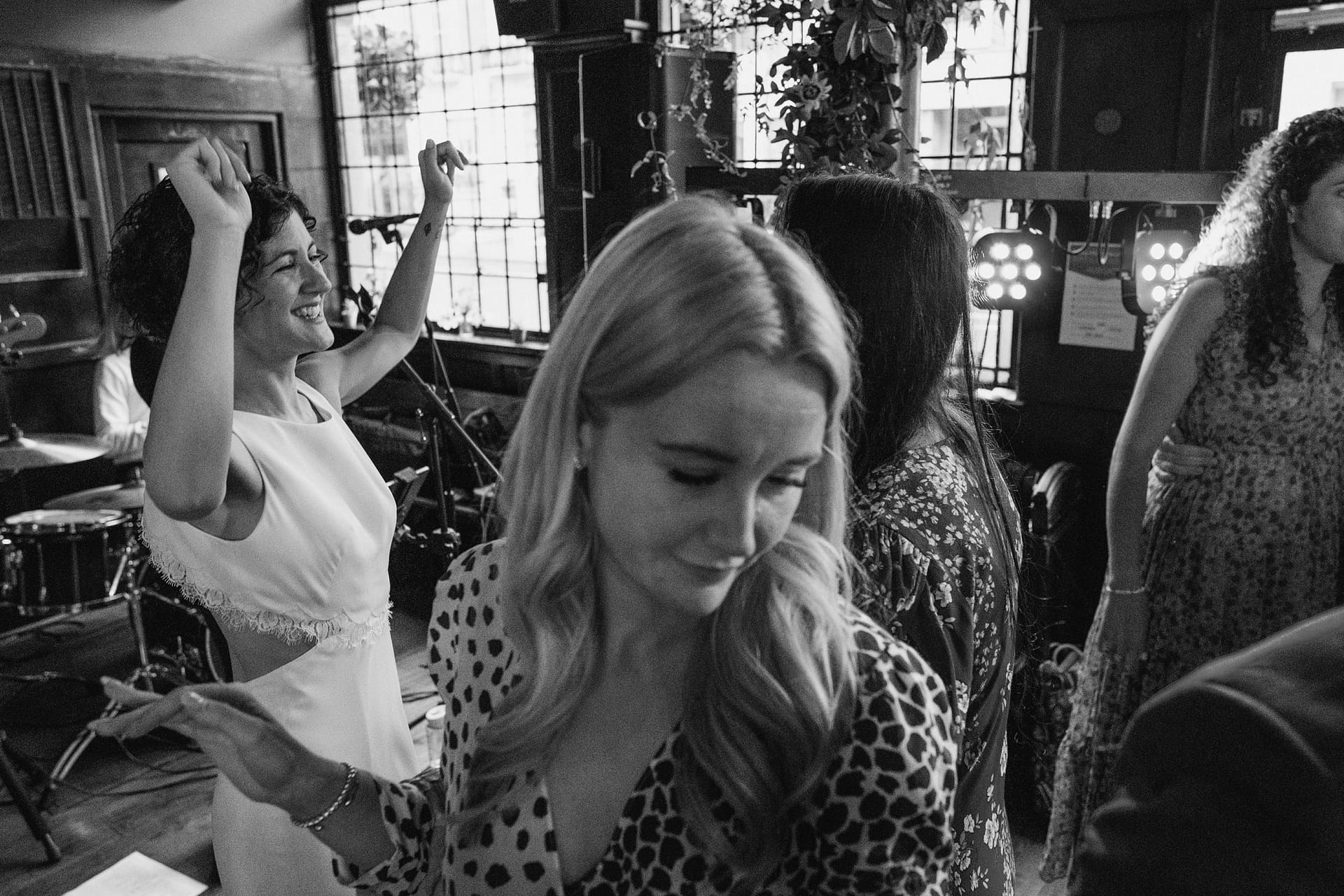 bride and guests on dance floor in london pub