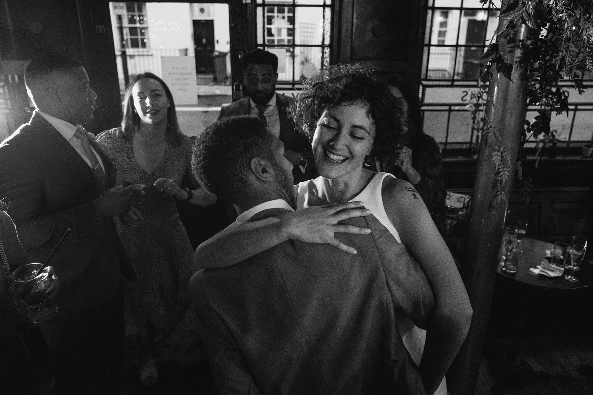 impromptu bride and groom hug at Prince Albert pub in london