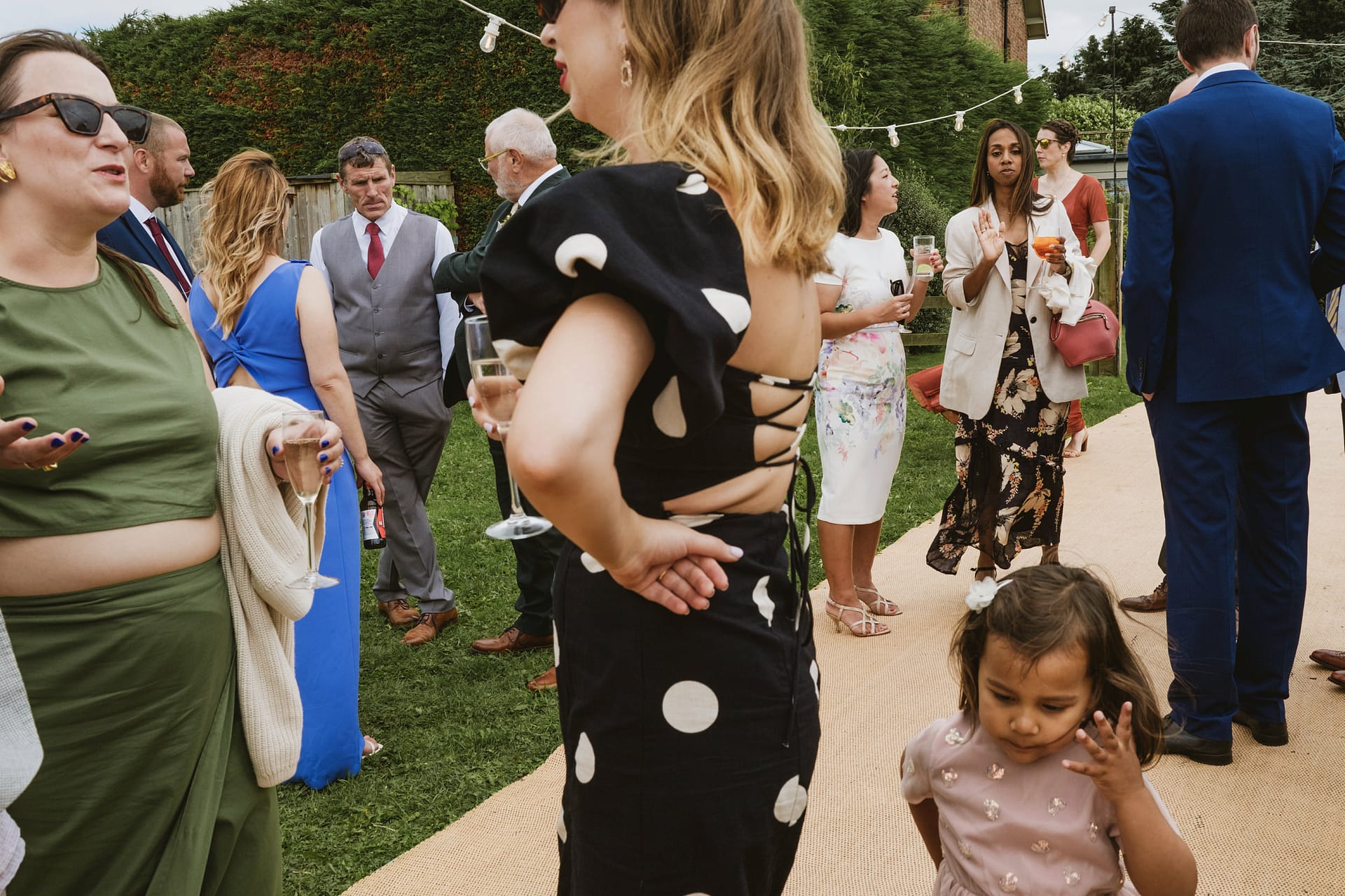 Group of people socialising at an outdoor event.