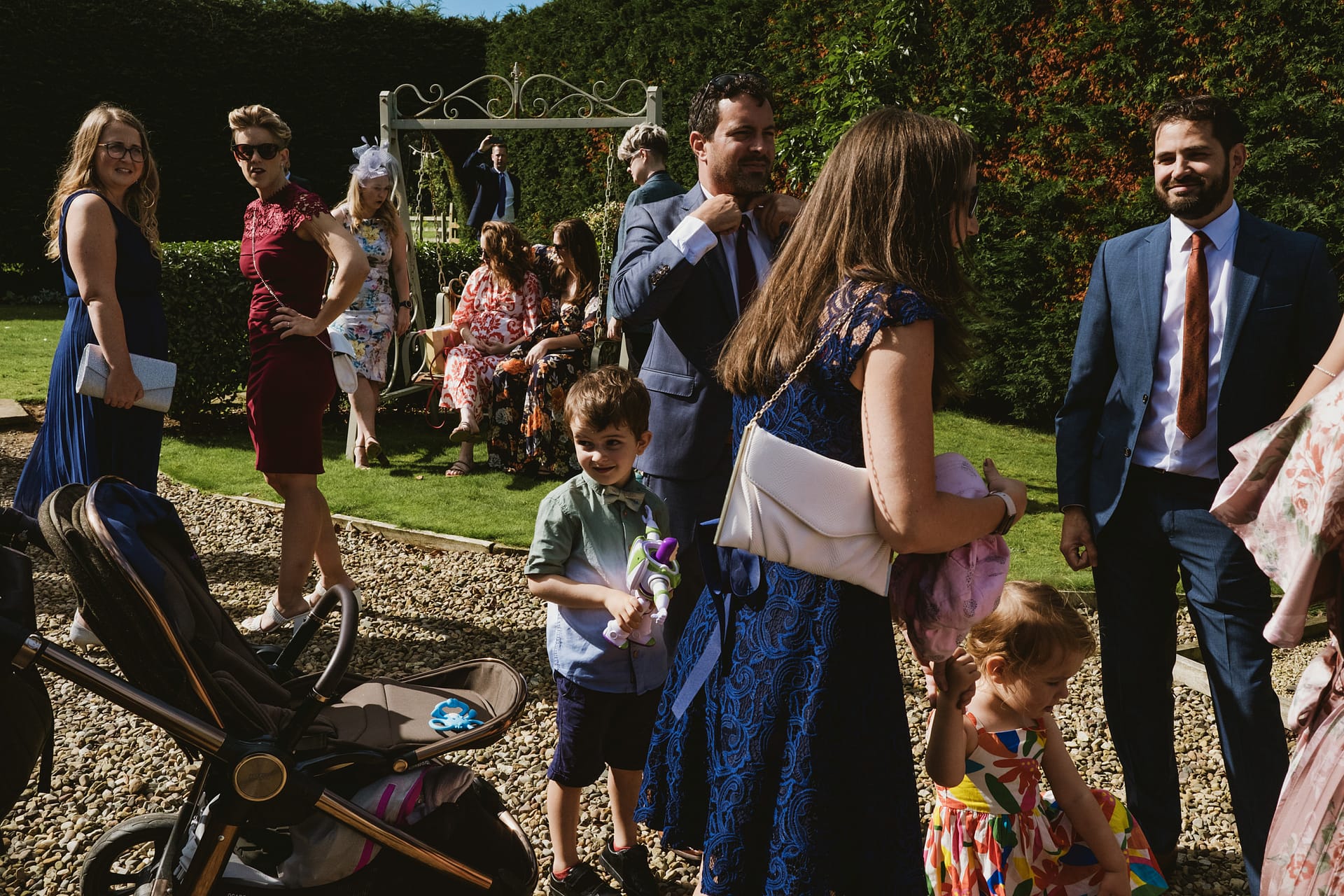 People socialising at an outdoor garden event.