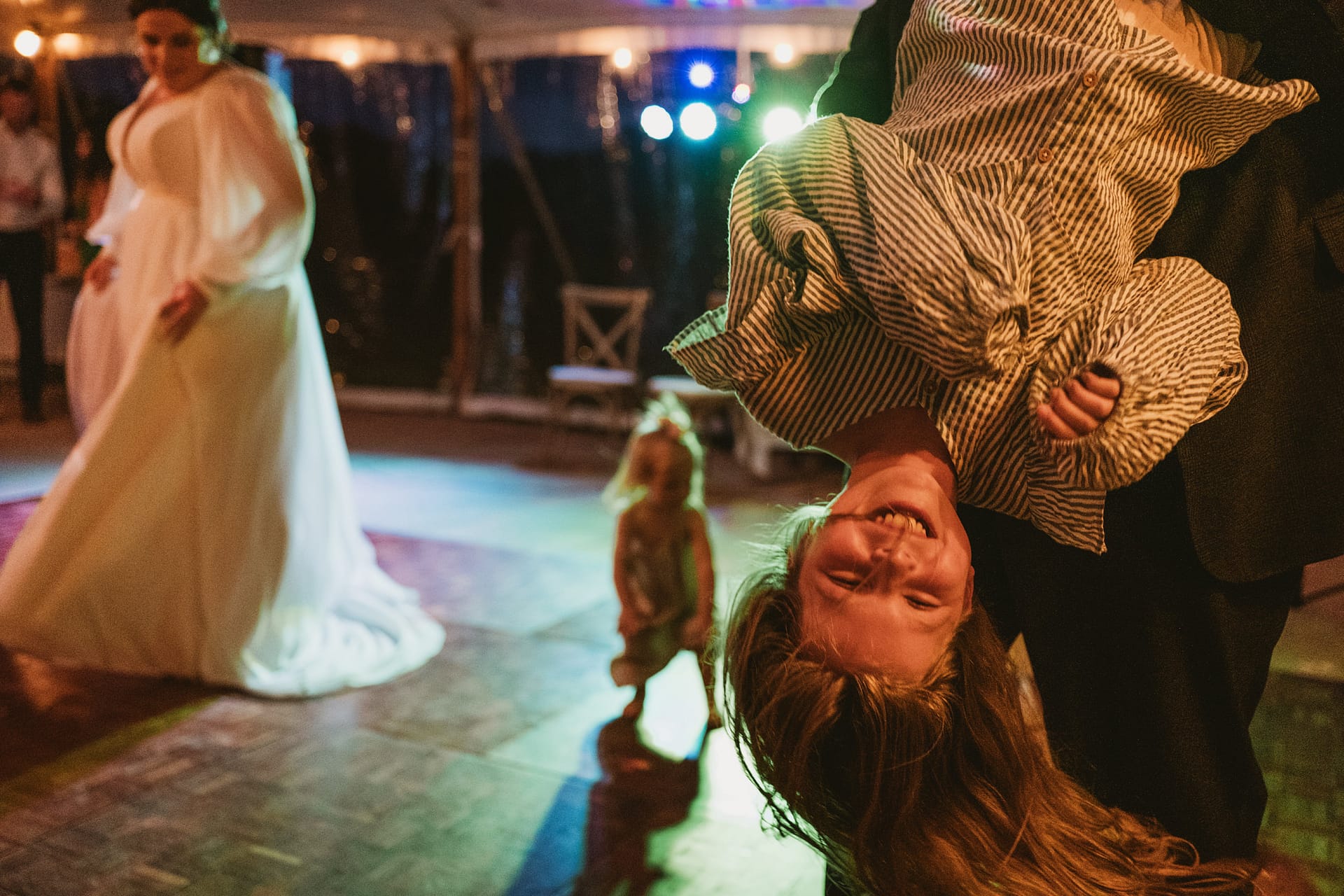 Children playing joyfully at wedding celebration.