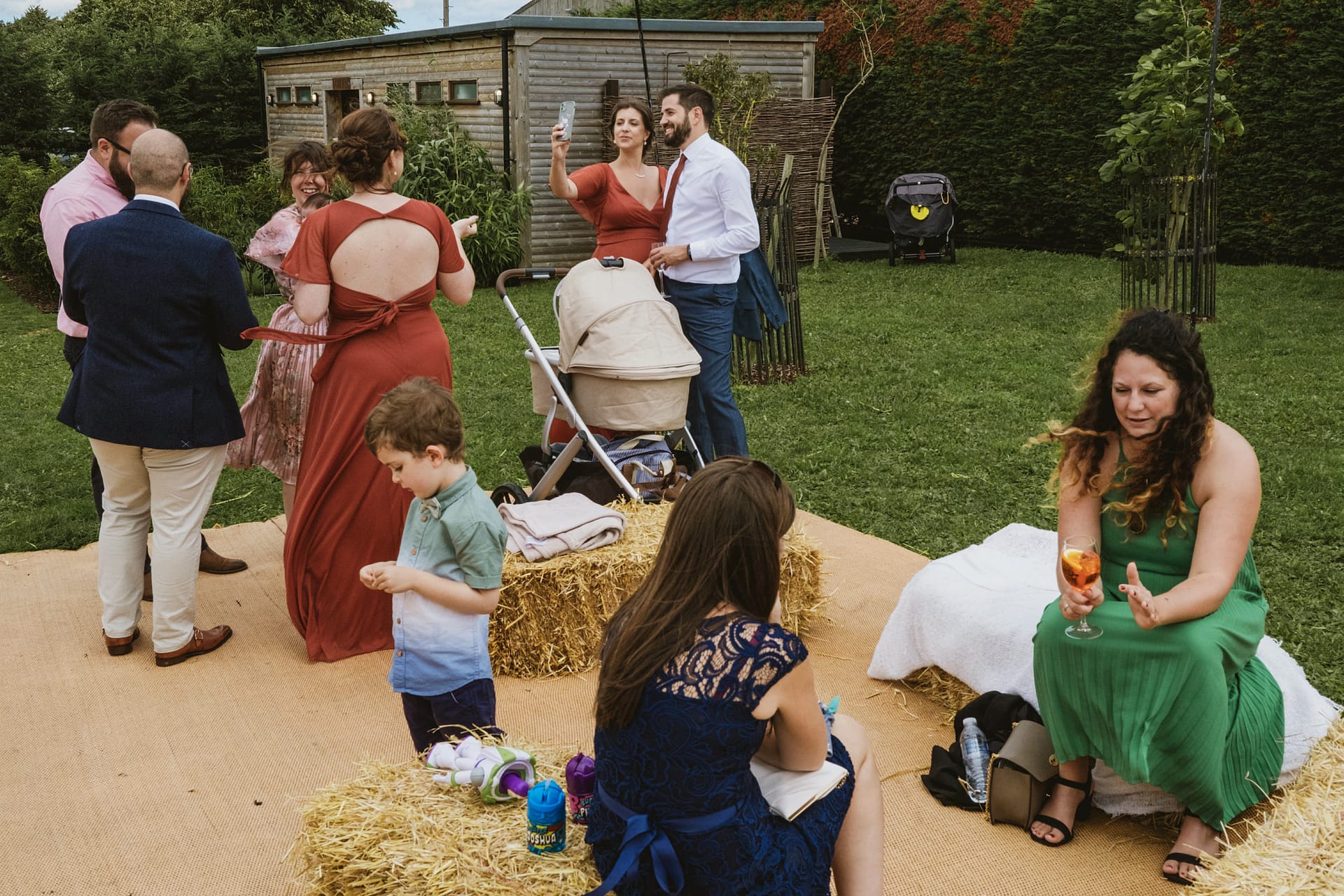 Outdoor gathering with people chatting and relaxing.