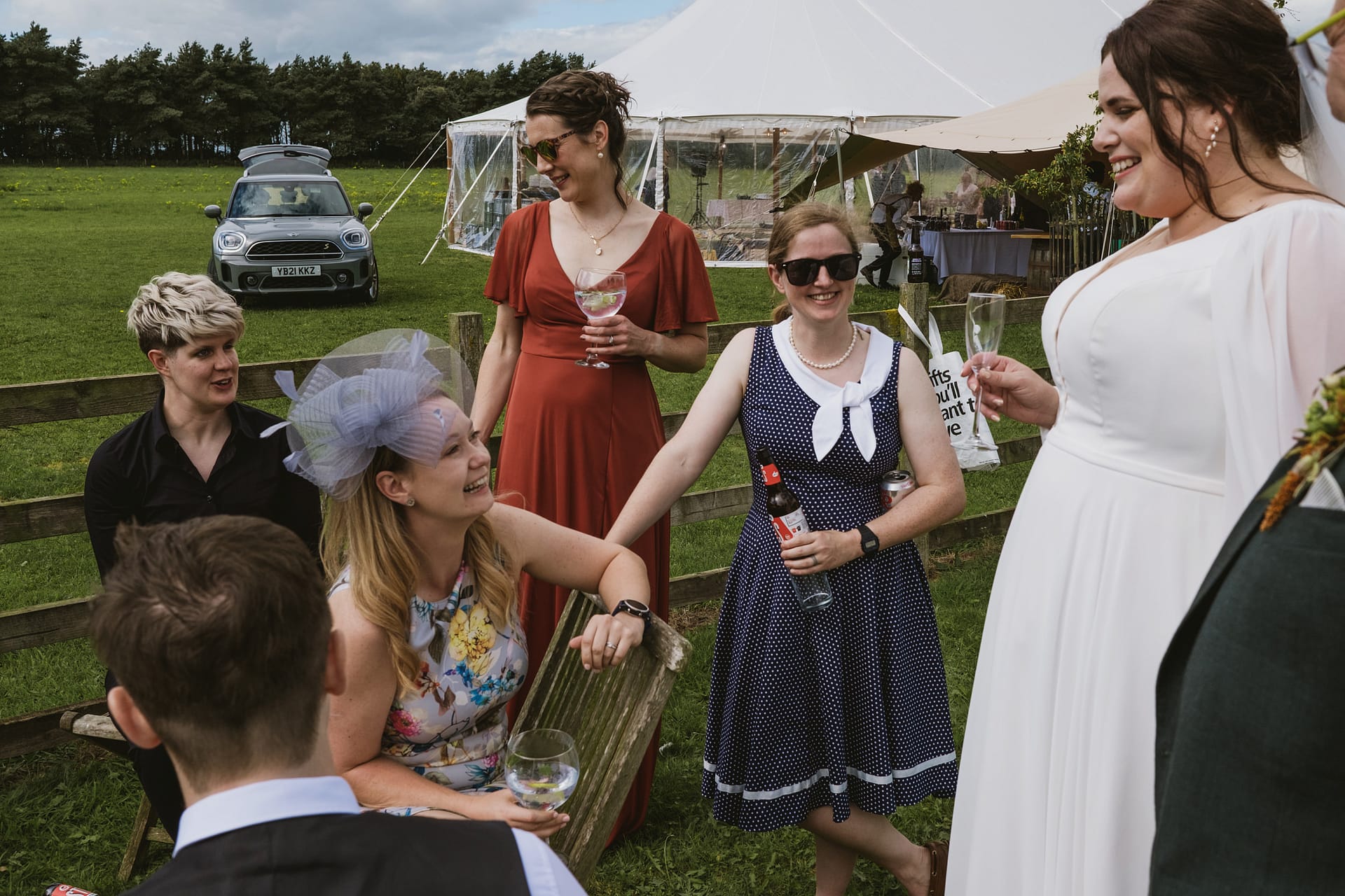 Guests enjoying outdoor wedding celebration.