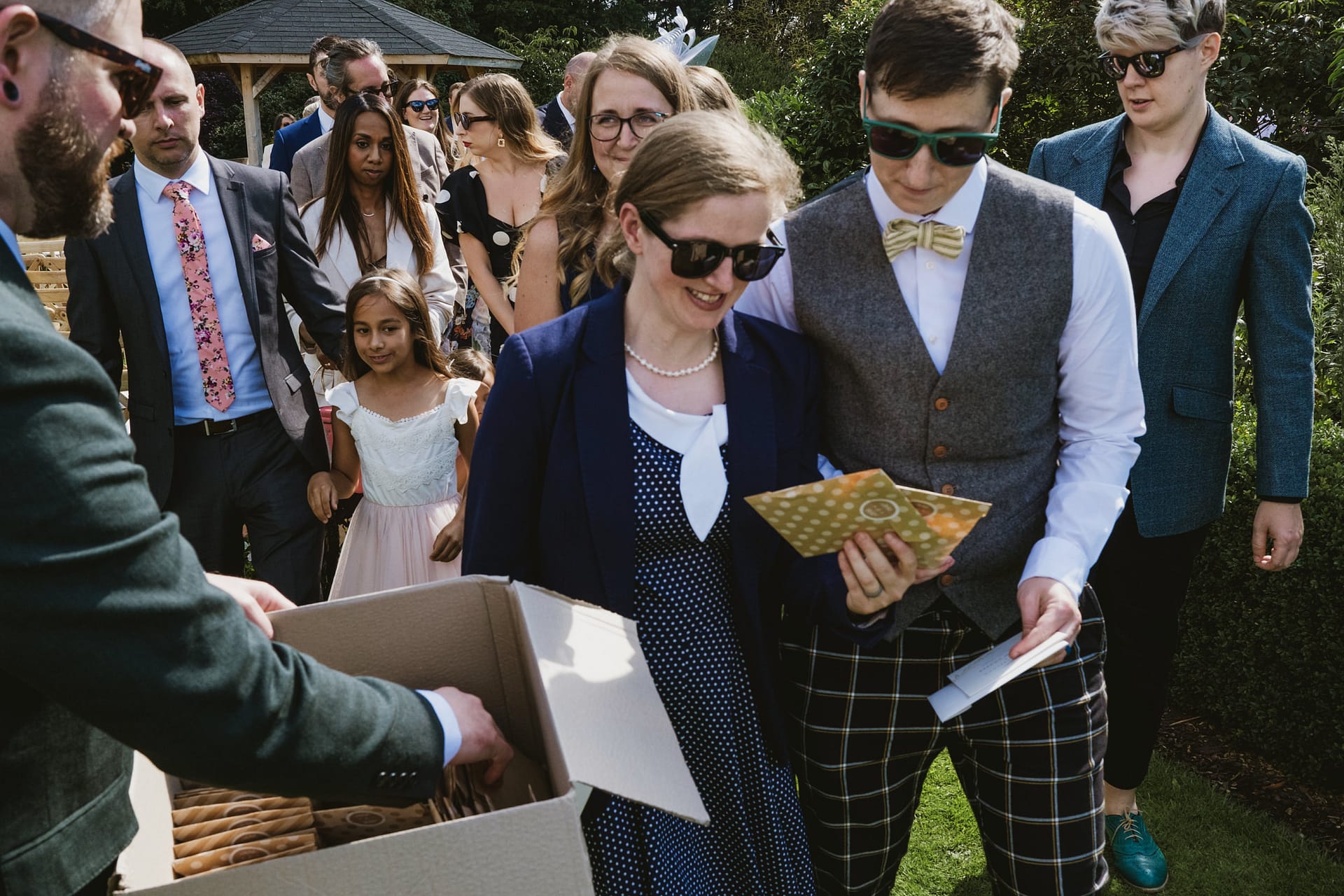 Outdoor gathering with smartly dressed people
