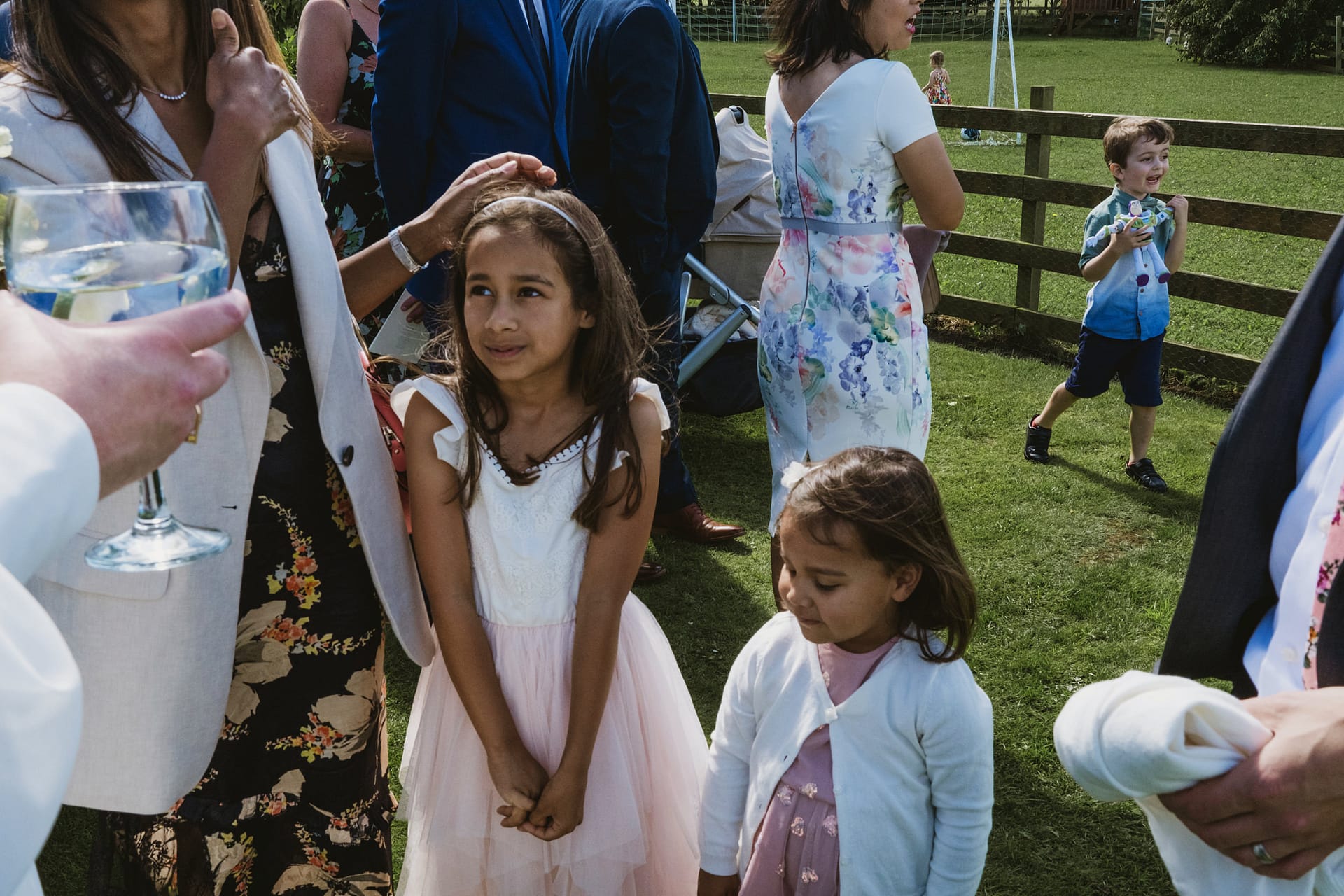 Children at outdoor summer party with adults.