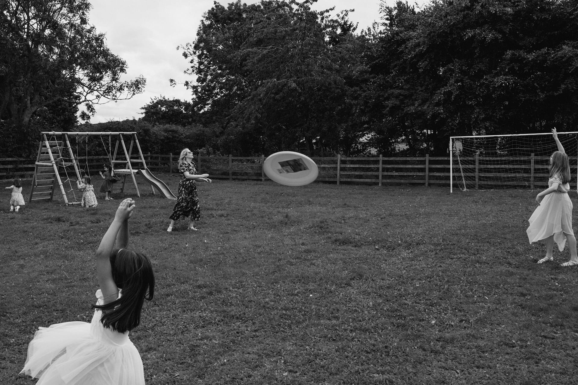 Children playing frisbee in the park.
