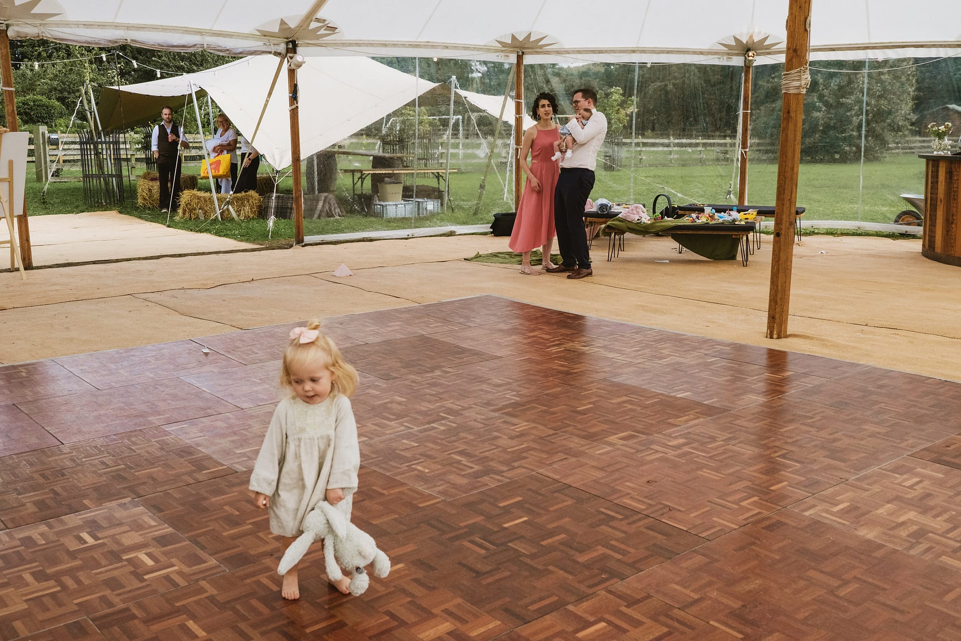 Child with toy on outdoor dance floor