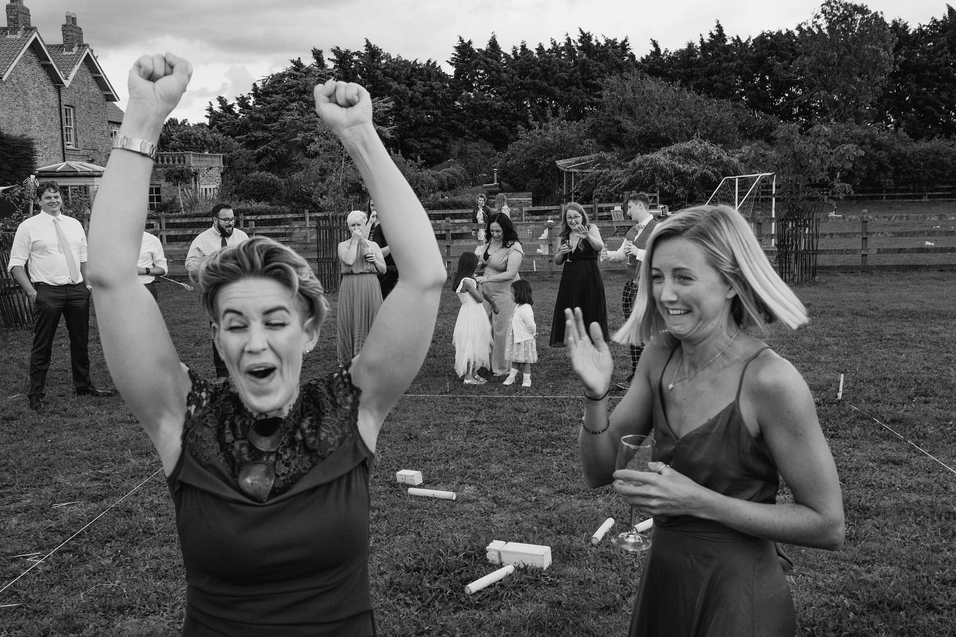 People celebrating happily at outdoor event.
