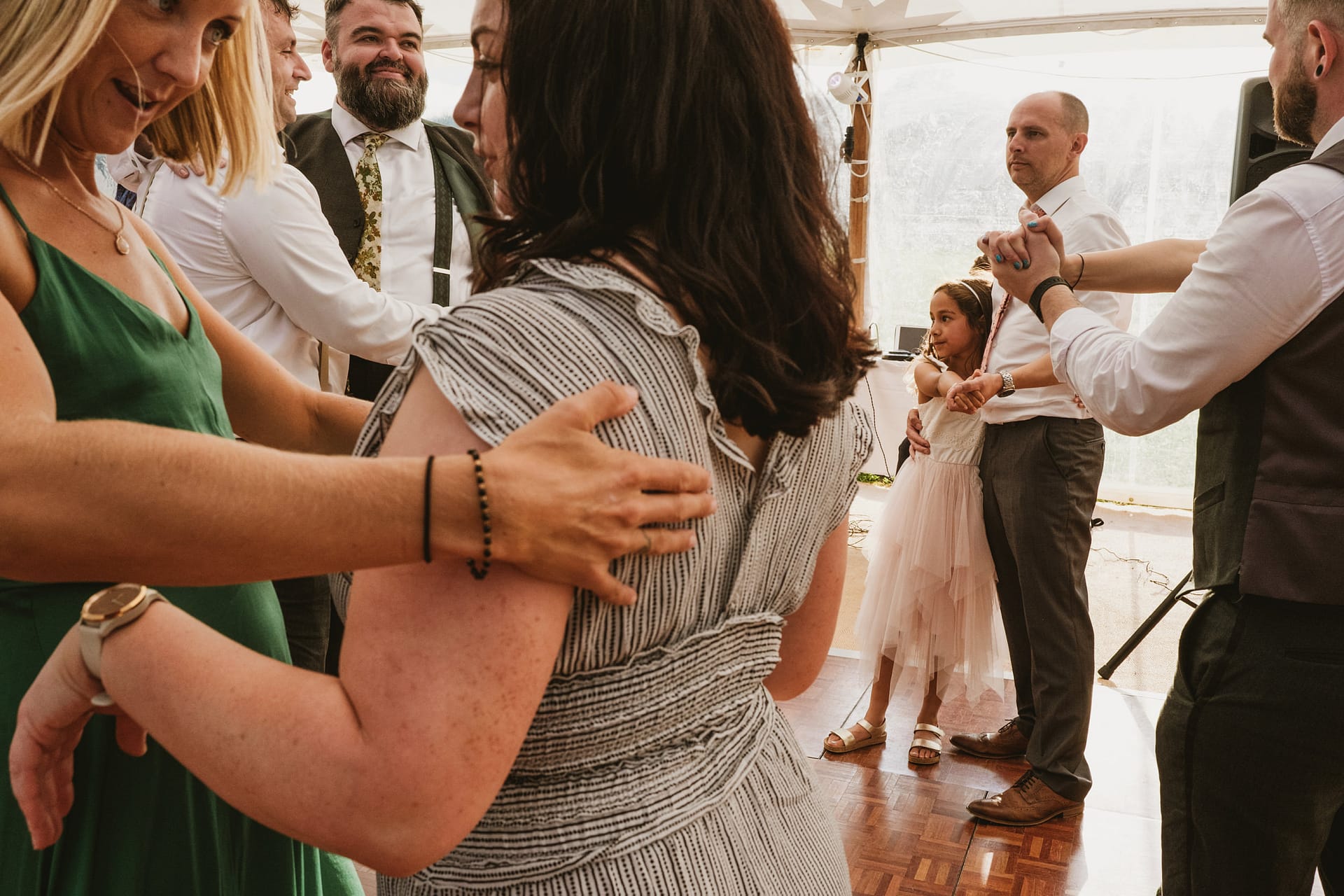 People dancing at a wedding reception.