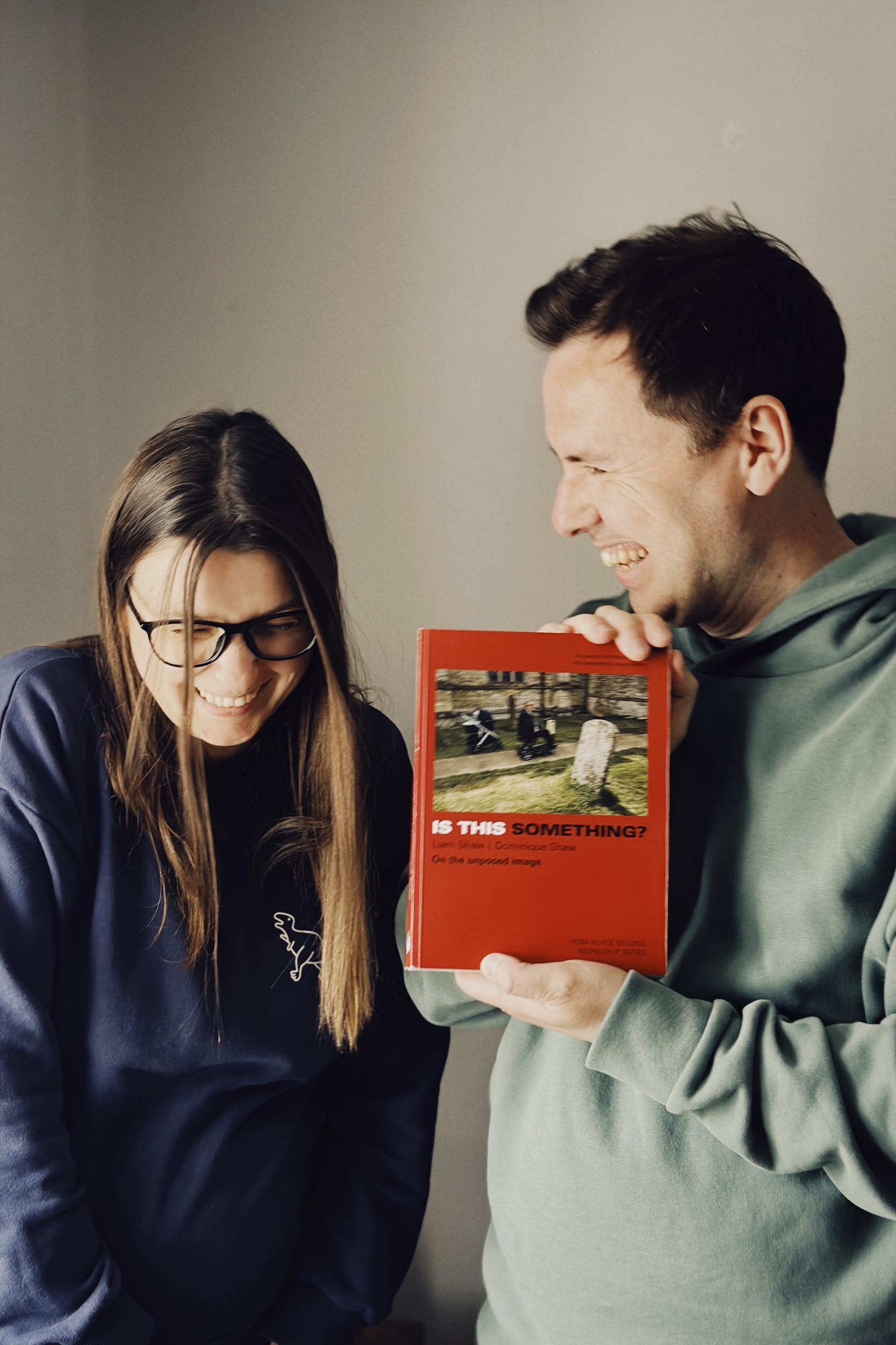dominique and liam viewing their proof for the first time