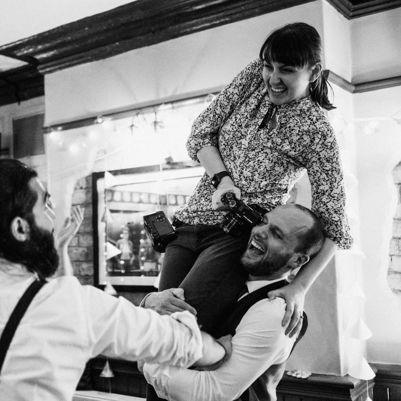 Wedding Photographer Dominique Shaw (York Place Studios) is raised on the shoulders of the groomsmen in a moment of ecstasy on the dance floor of a York Wedding