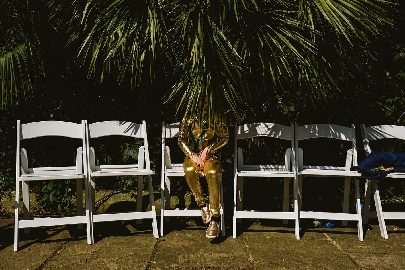 Pump House Battersea Park boy ninja in gold hidden by a tree