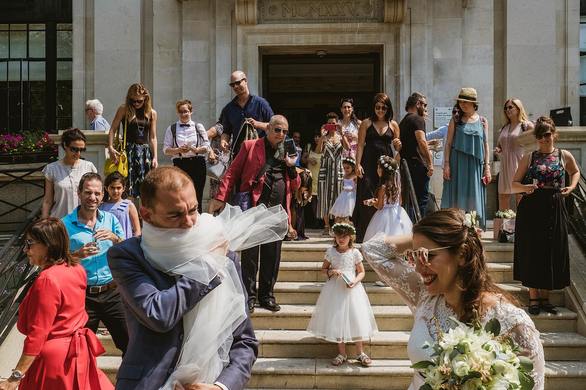 Islington Town Hall Wedding Photography London veil around head of groom