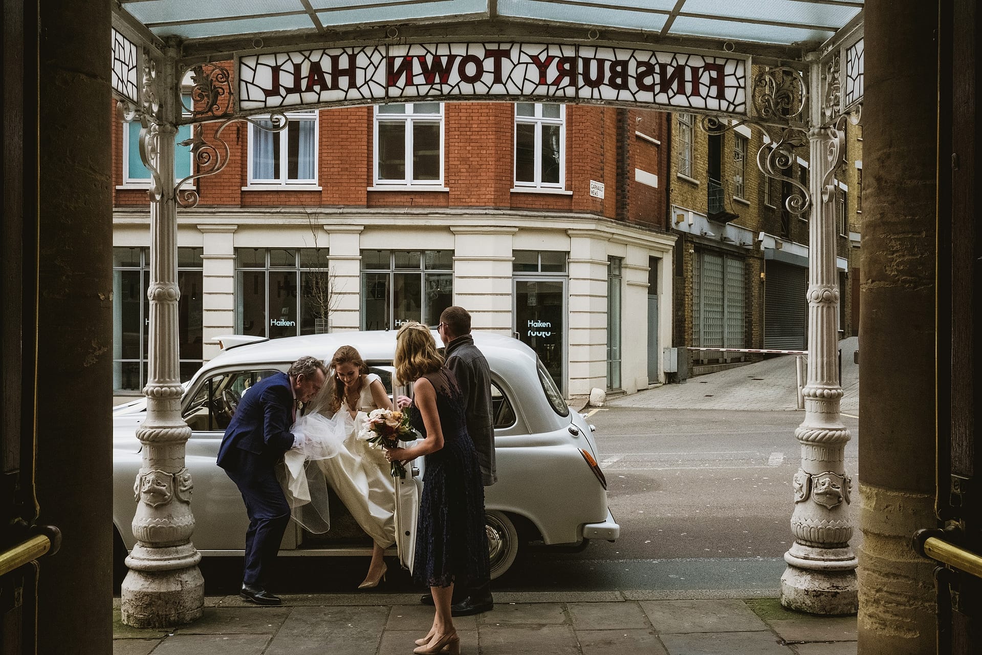 The Old Finsbury Town Hall Wedding Photography London bride coming out the wedding car