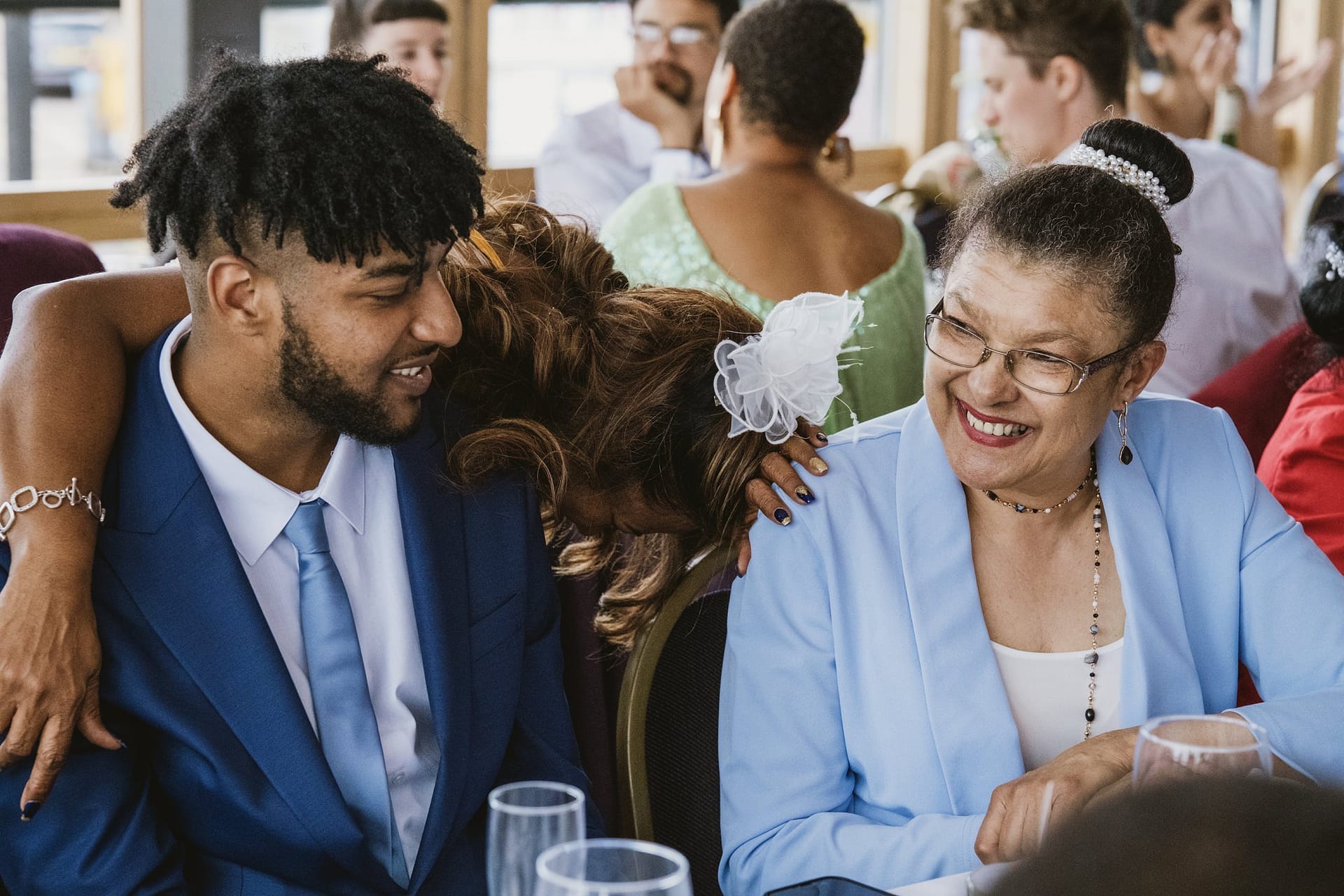 A man and woman sitting at a table, captured during the elegant Greenwich Yacht Club wedding.