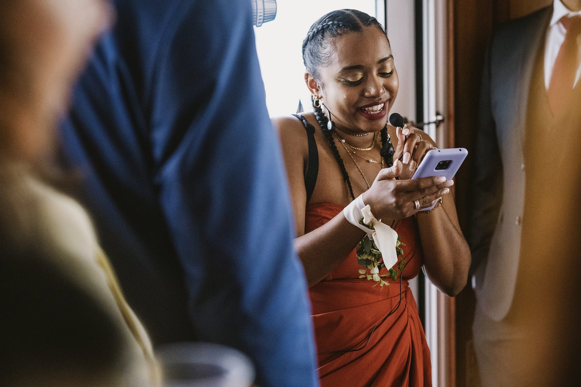 A woman is looking at her mobile phone at a Greenwich Yacht Club wedding party.
