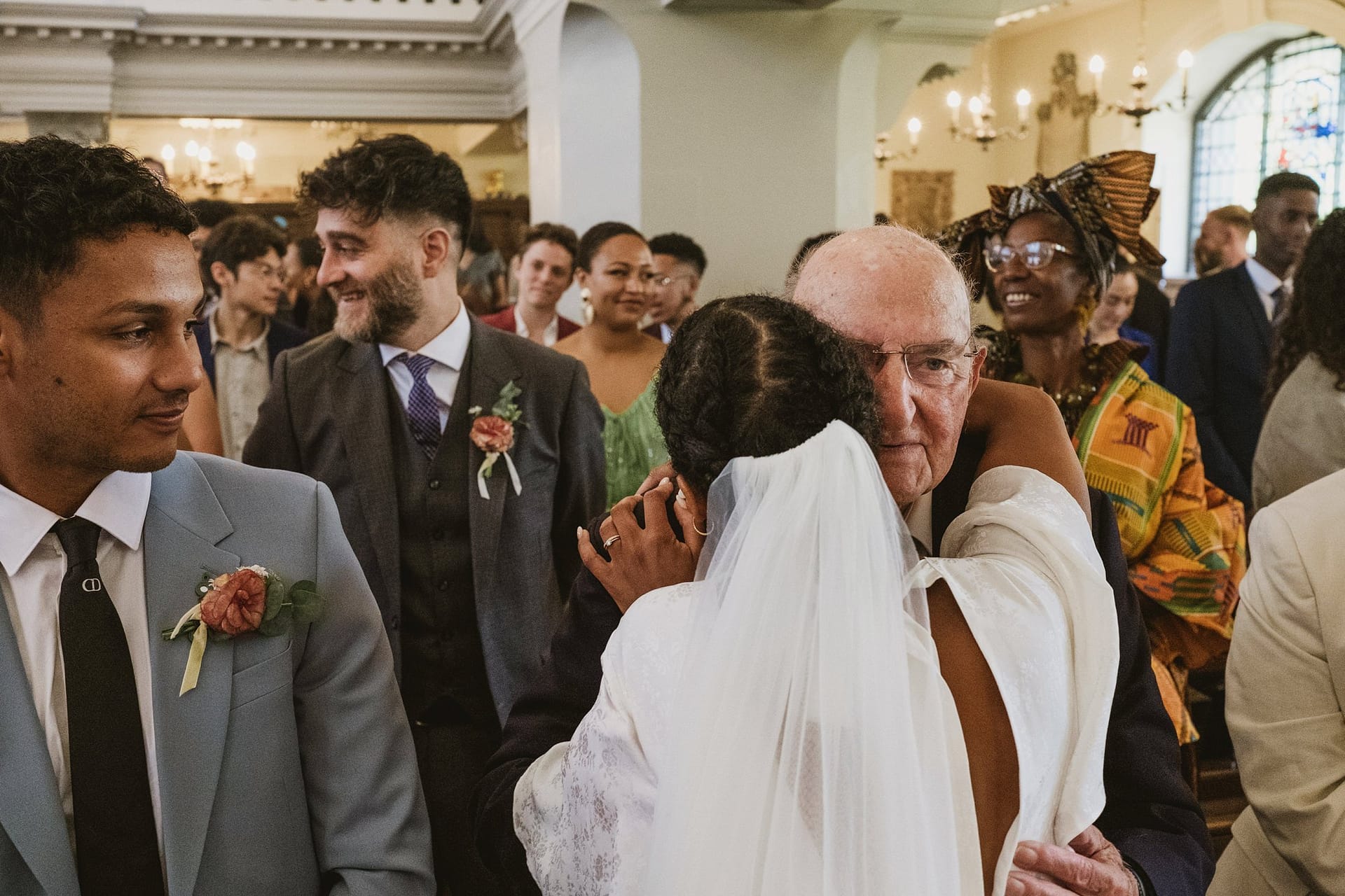 A man hugging a woman at their Greenwich Yacht Club wedding.